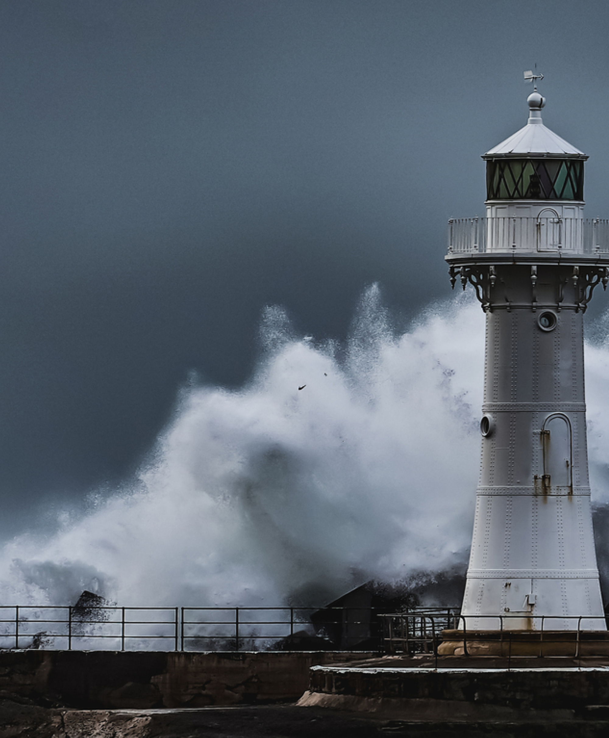 Stormy ocean and lighthouse photo