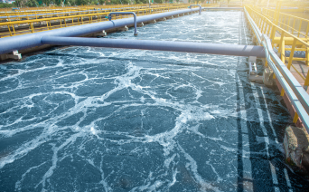 Hands collecting clean water from a flowing source