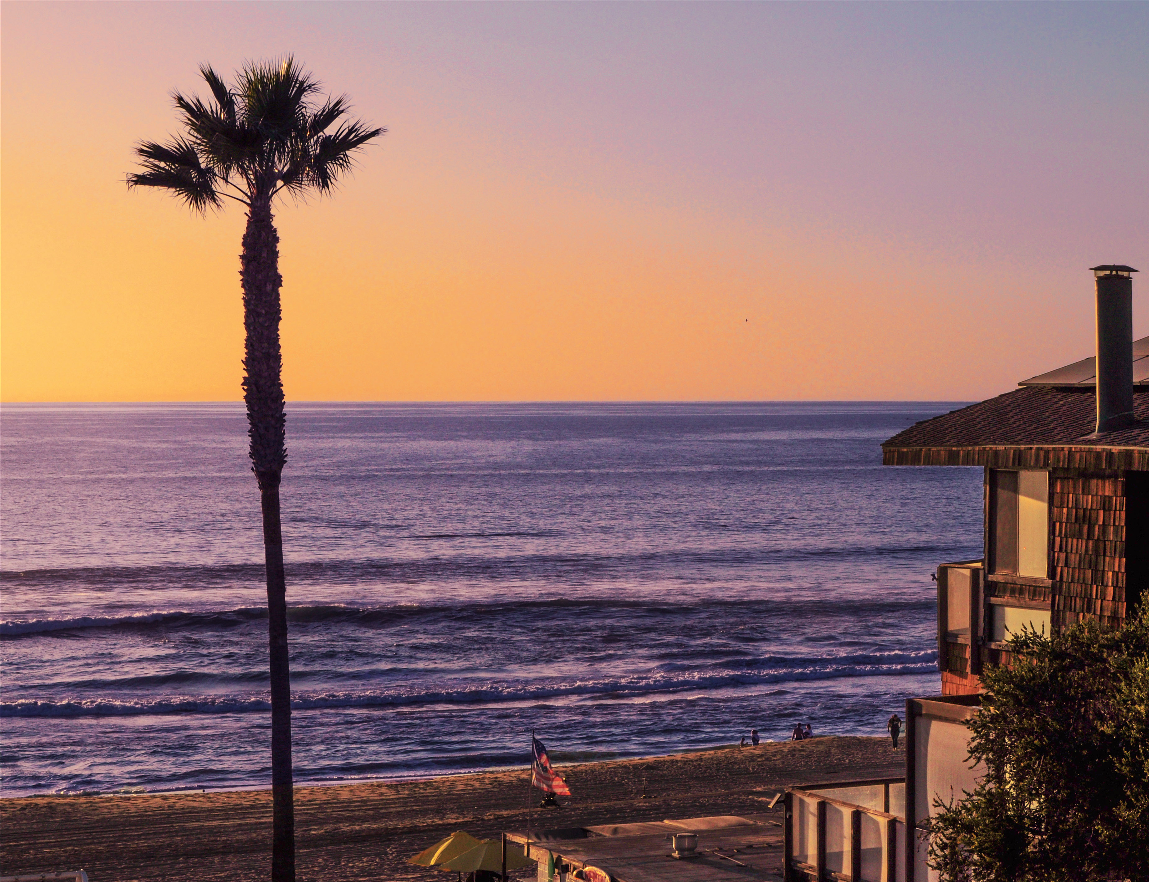 Attractive aged businesswoman, teacher or mentor coach speaking to young people, senior woman in glasses teaching audience at training seminar, female business leader speaker talking at meeting