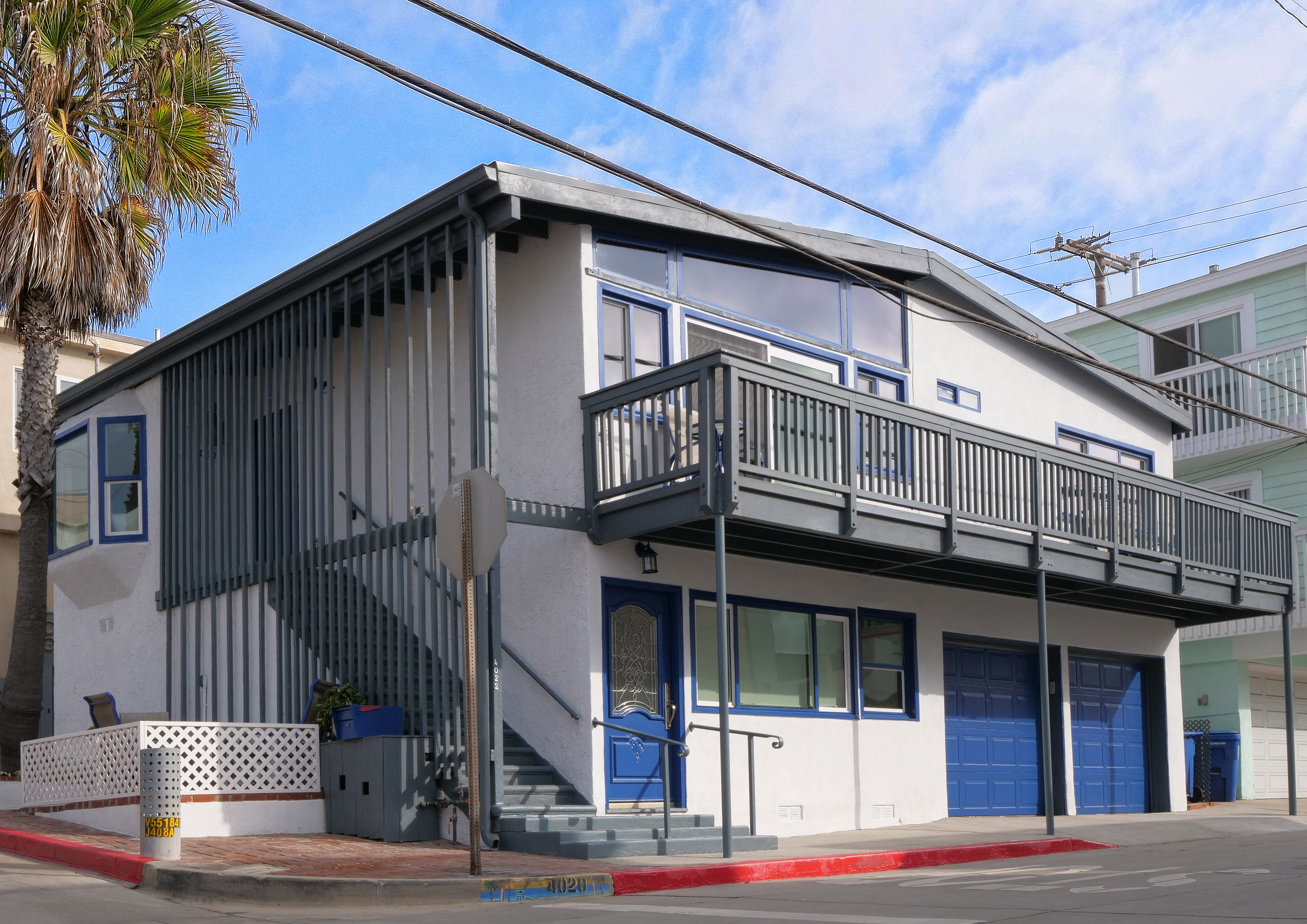 Female manager stands addressing team at board meeting