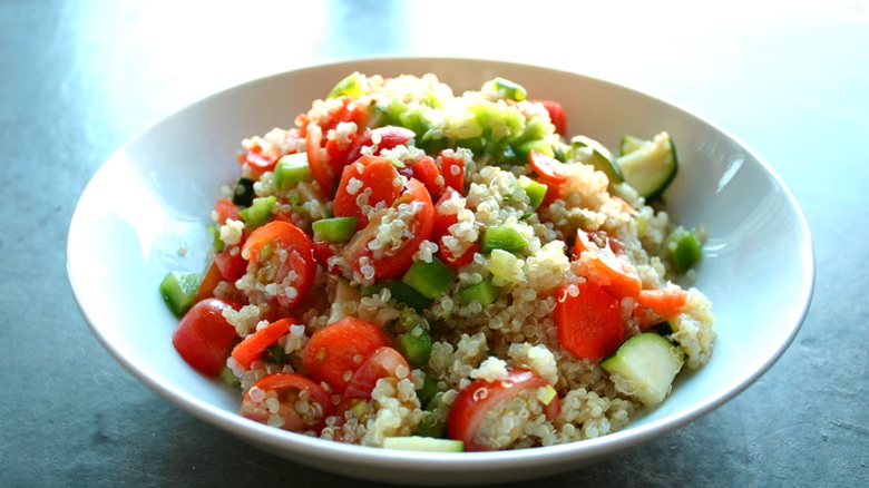 Older adult gratefully receiving a crate full of healthy food from a meal program. 