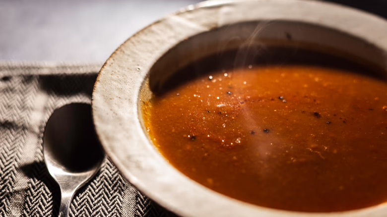 Older adult gratefully receiving a crate full of healthy food from a meal program. 