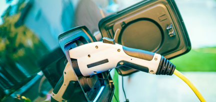 Solar Power Plant in modern city in sunset,Sustainable Renewable Energy