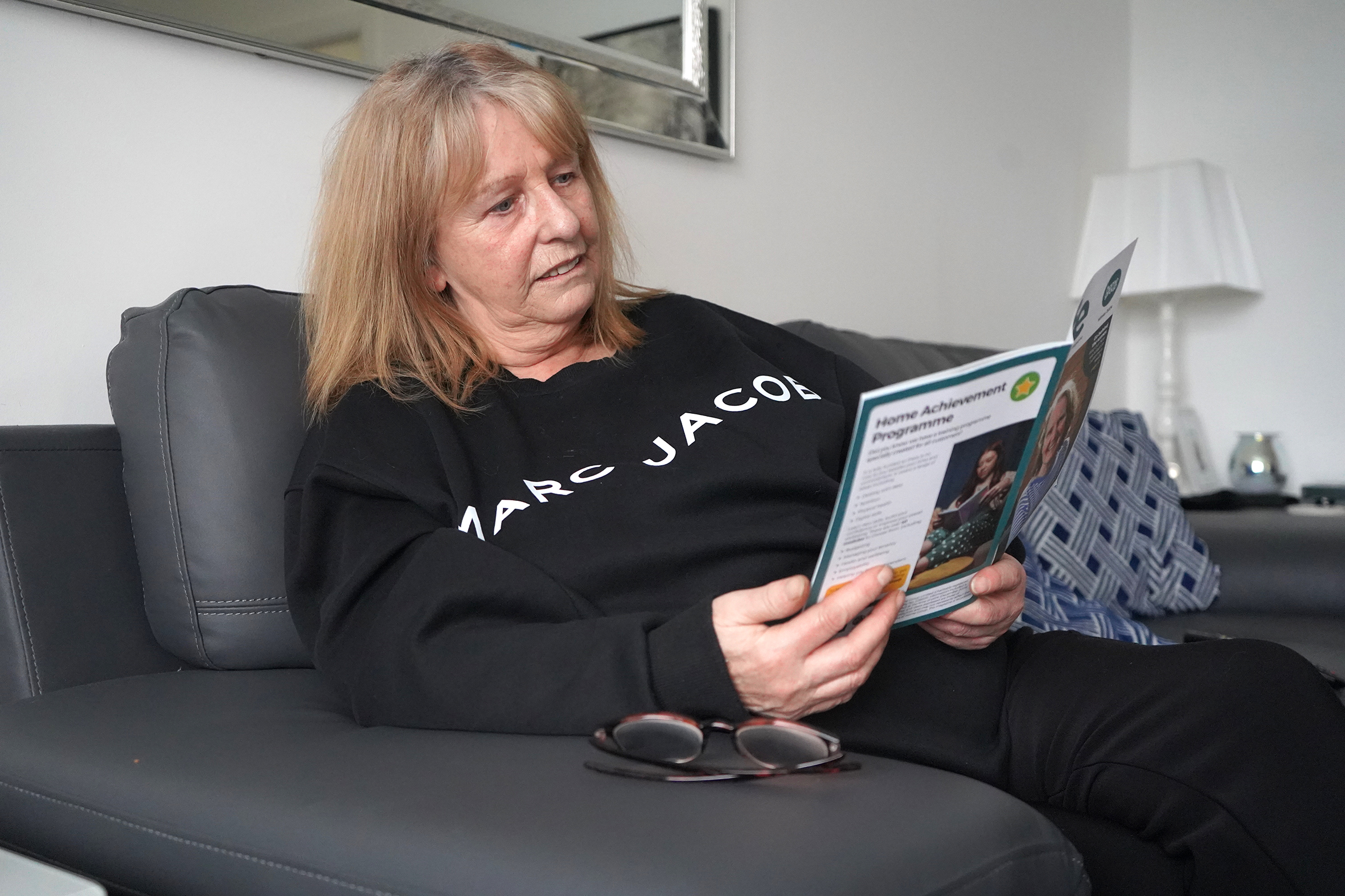 Image of a Home Group customer reading Homelife magazine