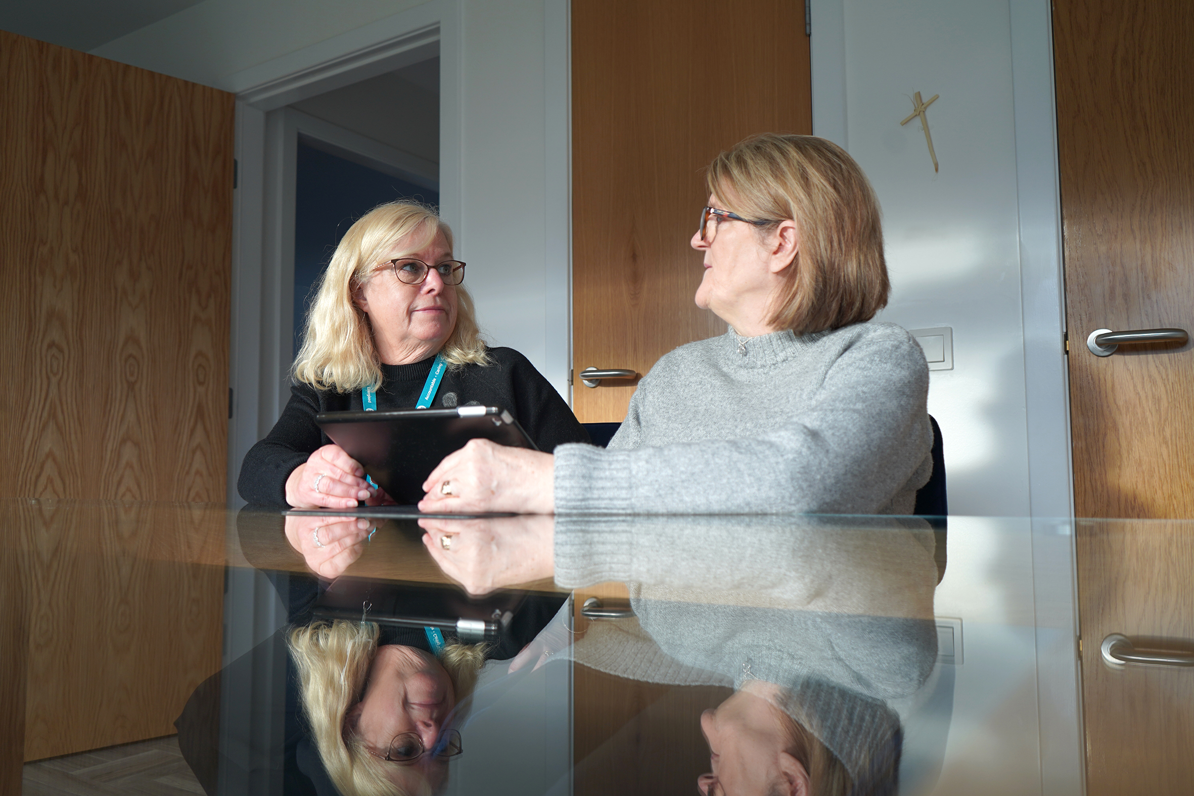 Image of 2 customers chatting