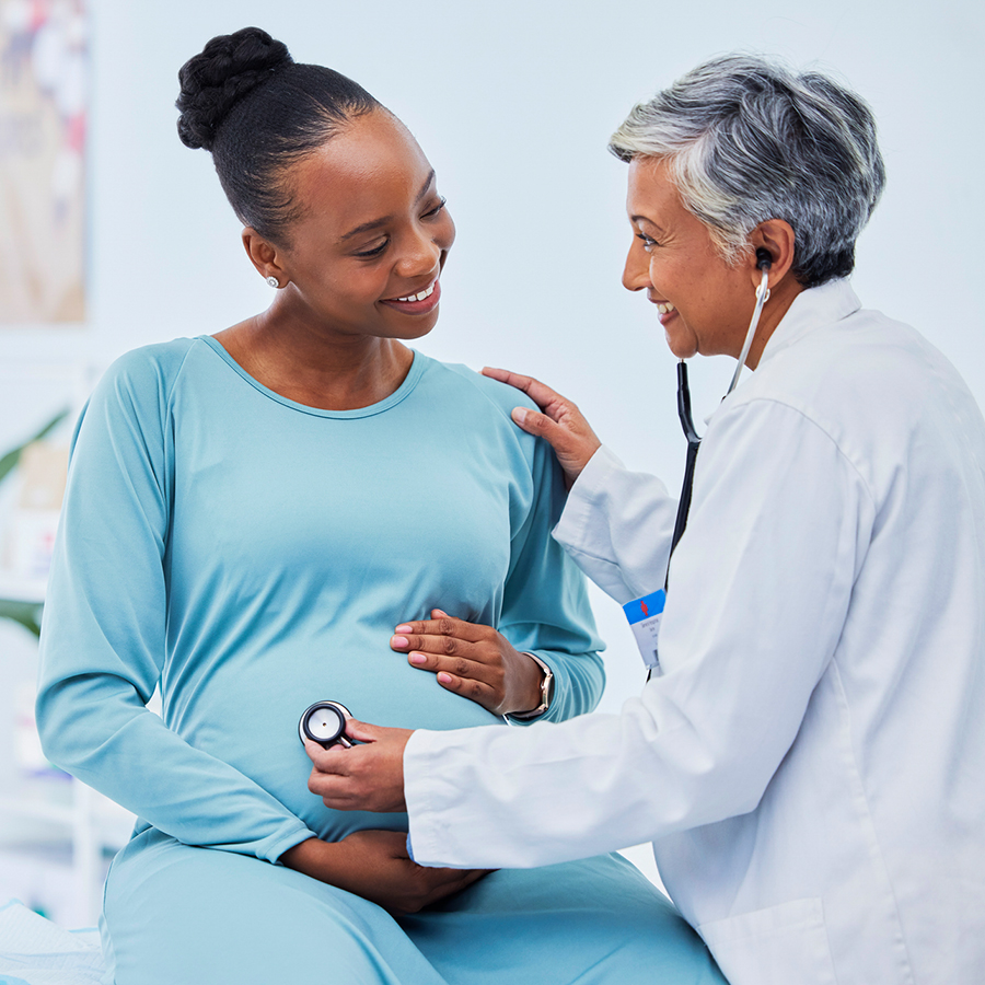 Black woman, pregnant and doctor listening to heart beat in checkup, appointment or visit at hospital. 