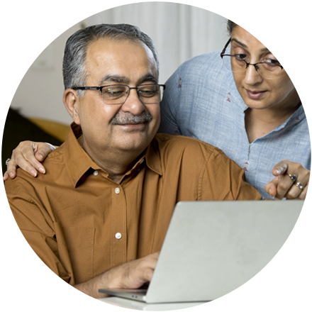 Man and woman looking at a laptop