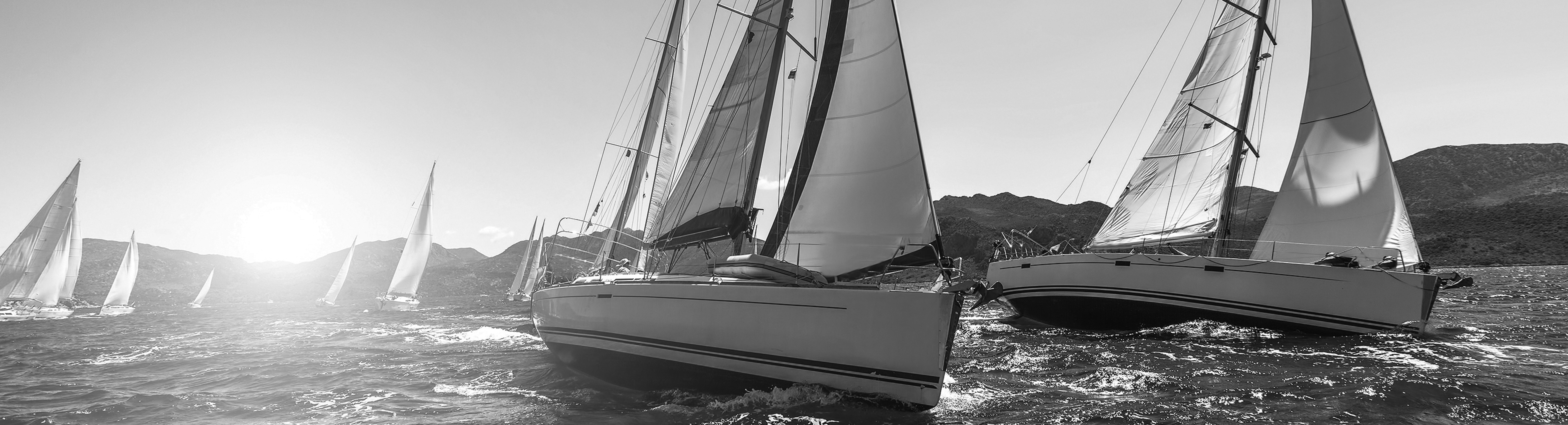 marina on water with boats and blue skies