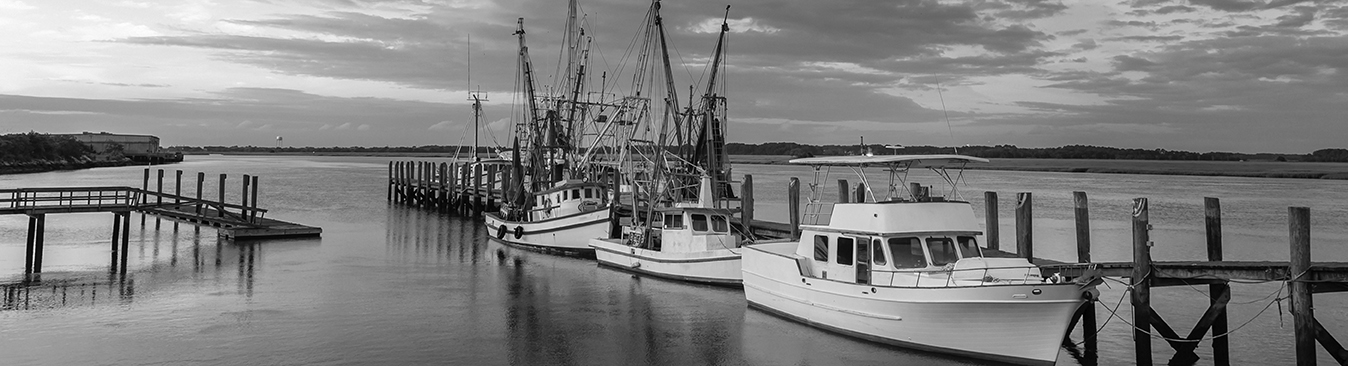blue background of boats at a dock