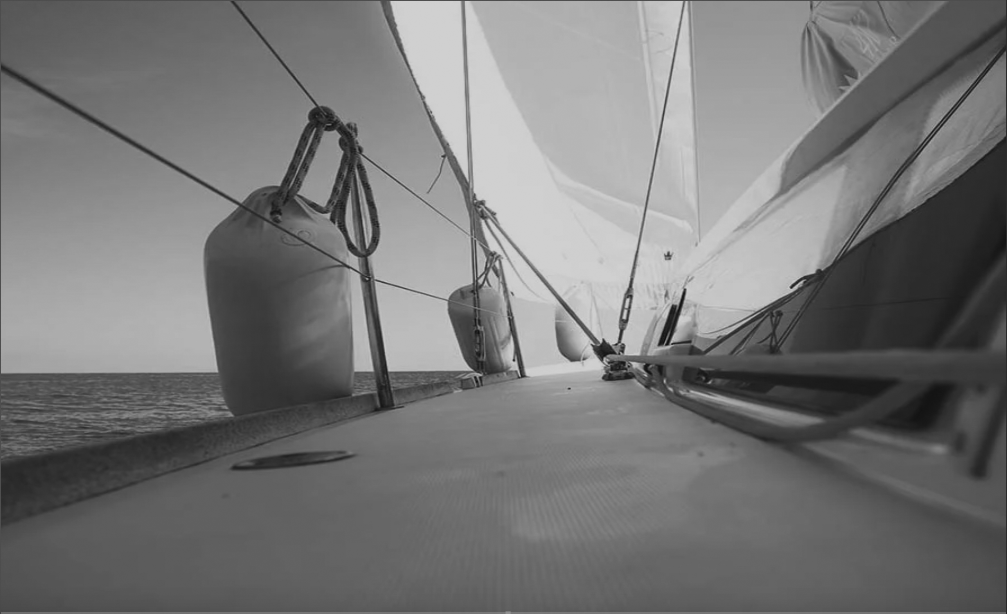 marina on water with boats and blue skies