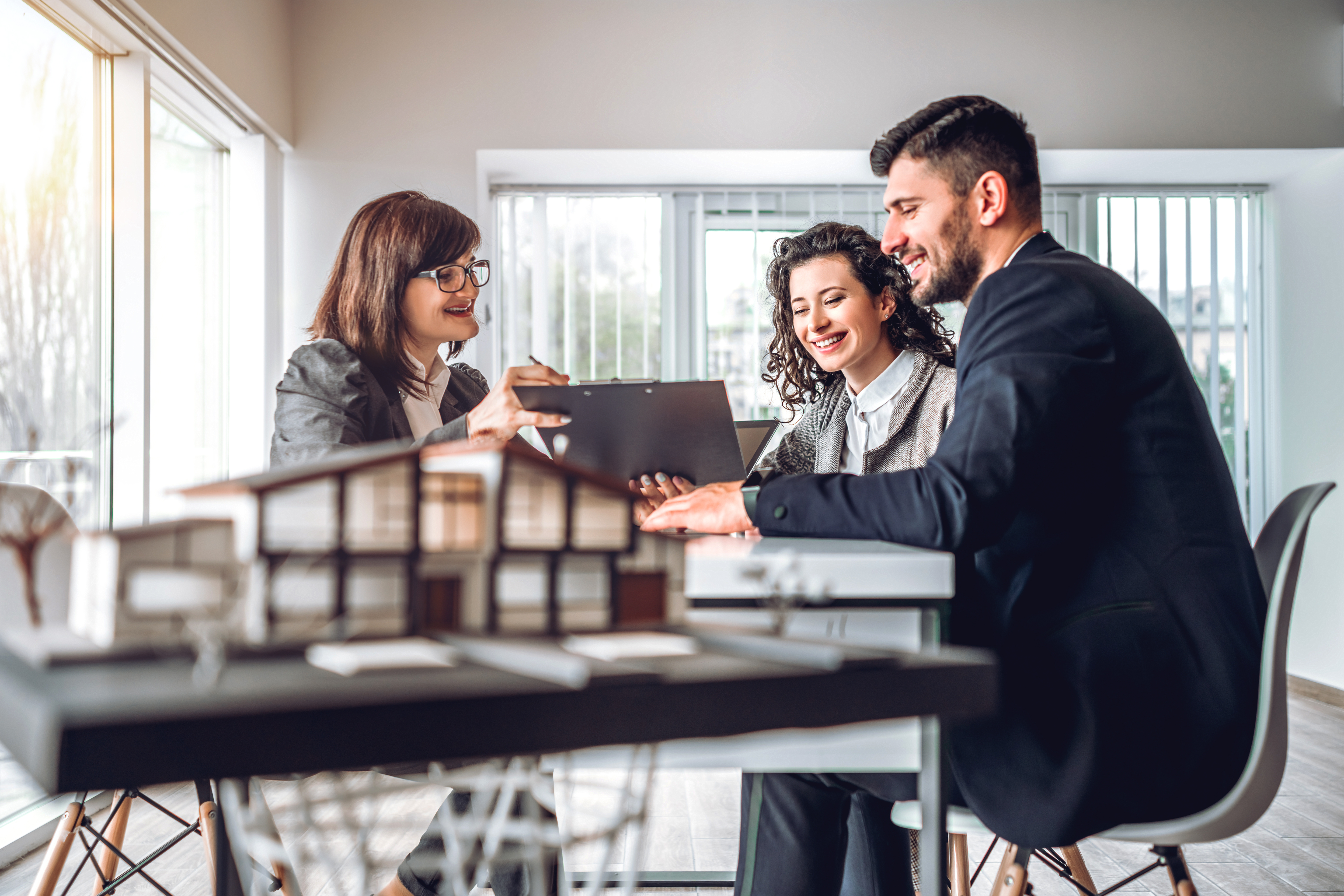 Adviser and clients in a meeting