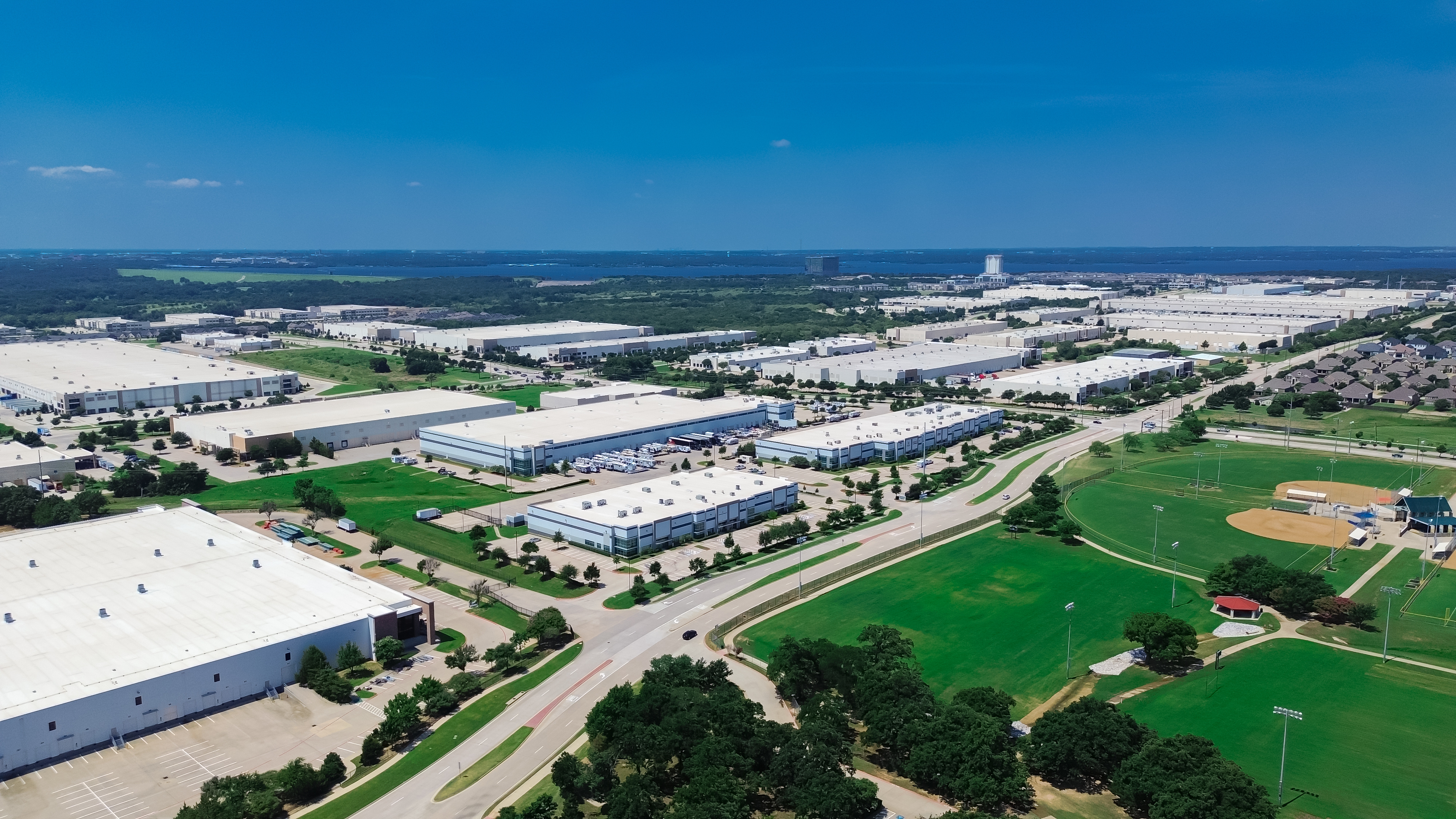 Industrial zone on suburb with basketball field park