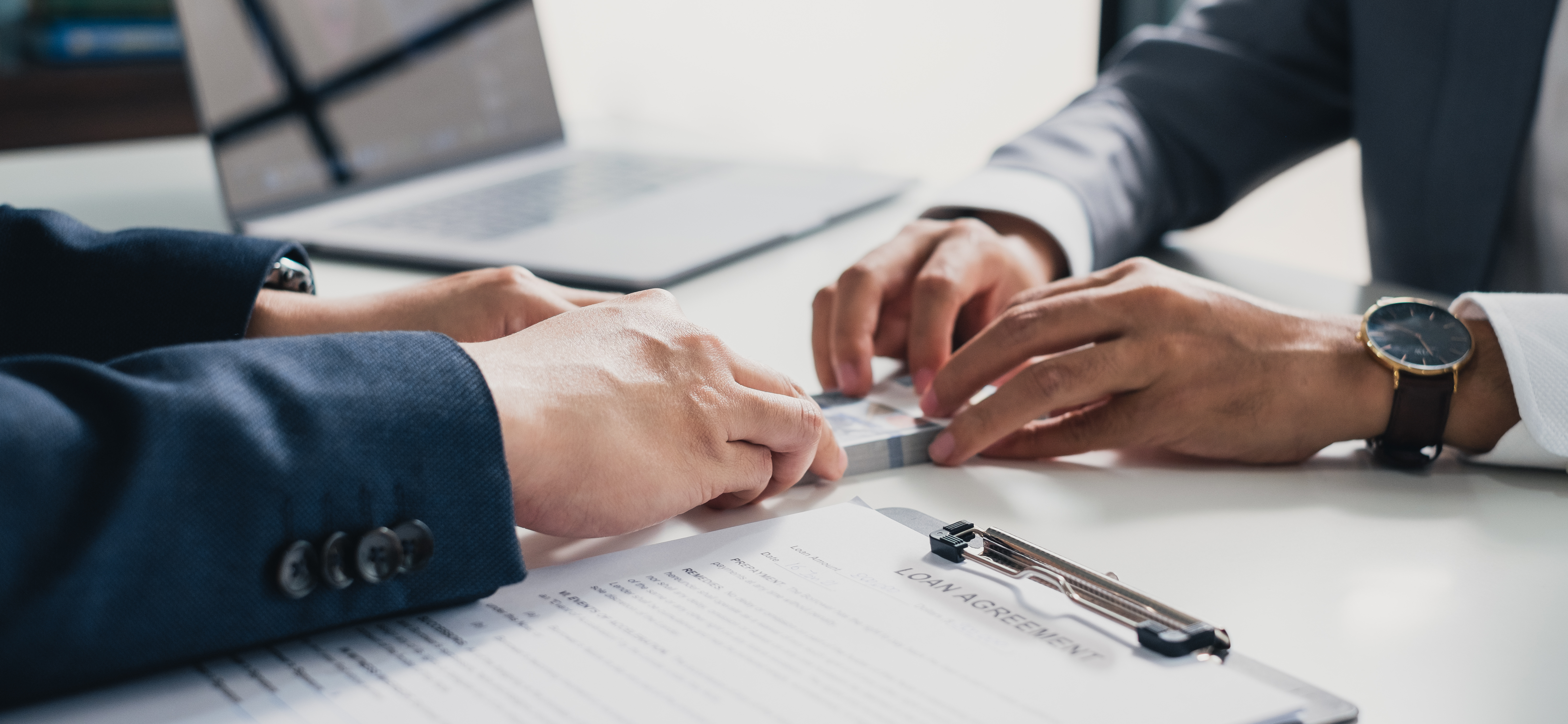 banker giving cash money to businessman
