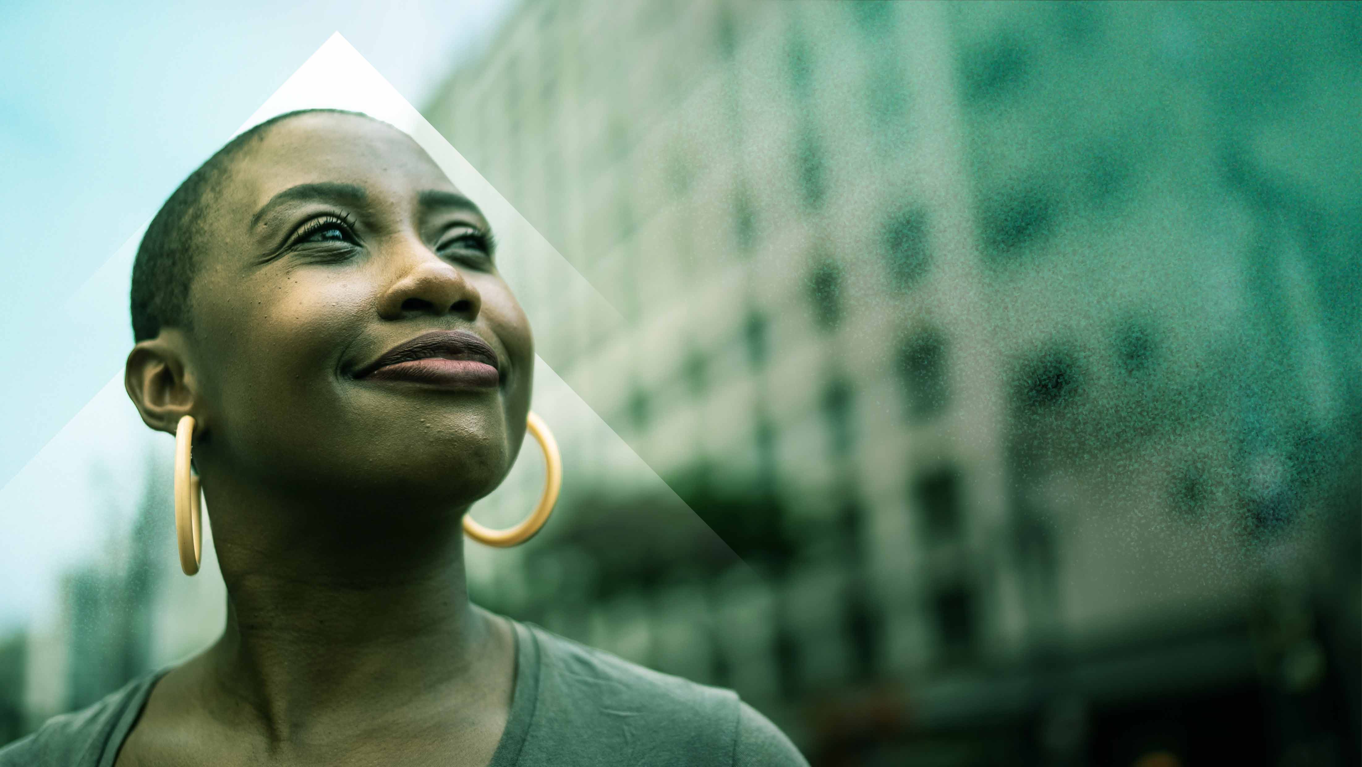 Header image of a person looking upwards, smiling
