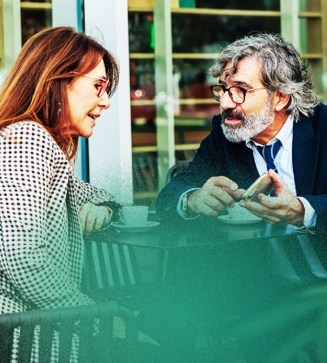Thumbnail image of two colleagues talking over coffee