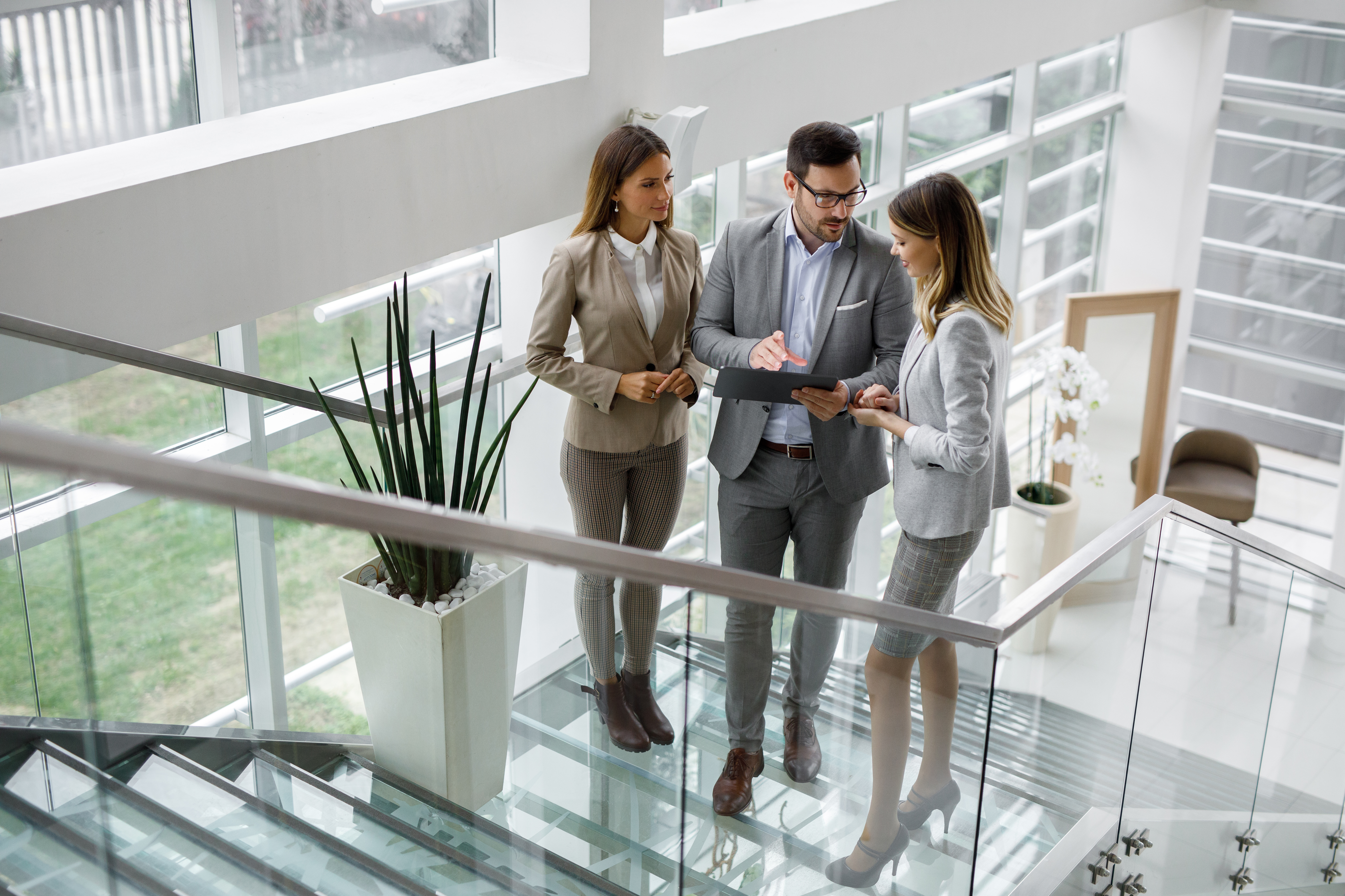 Latin woman working on a laptop doing her budget.