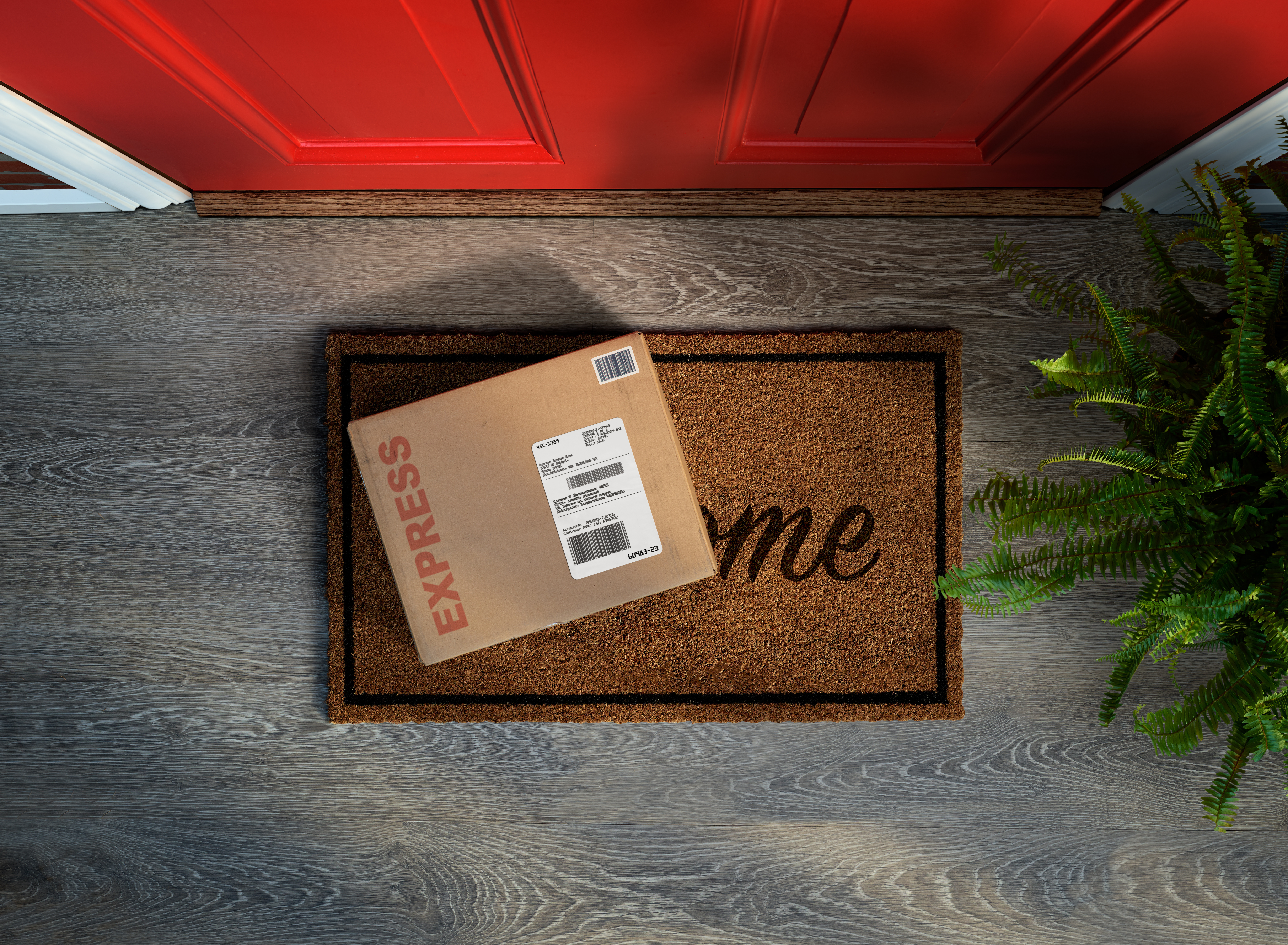 Shipping box on a welcome mat