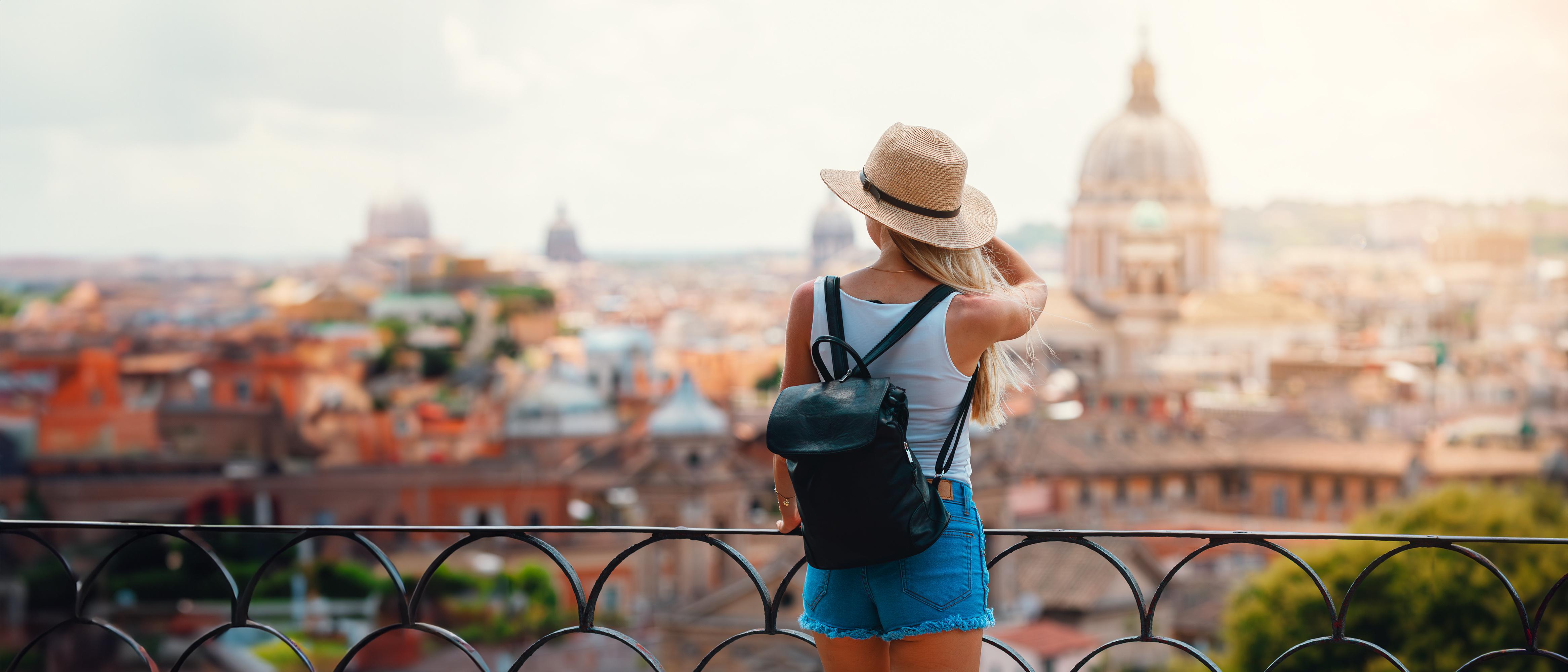 Tourist overlooking a European city
