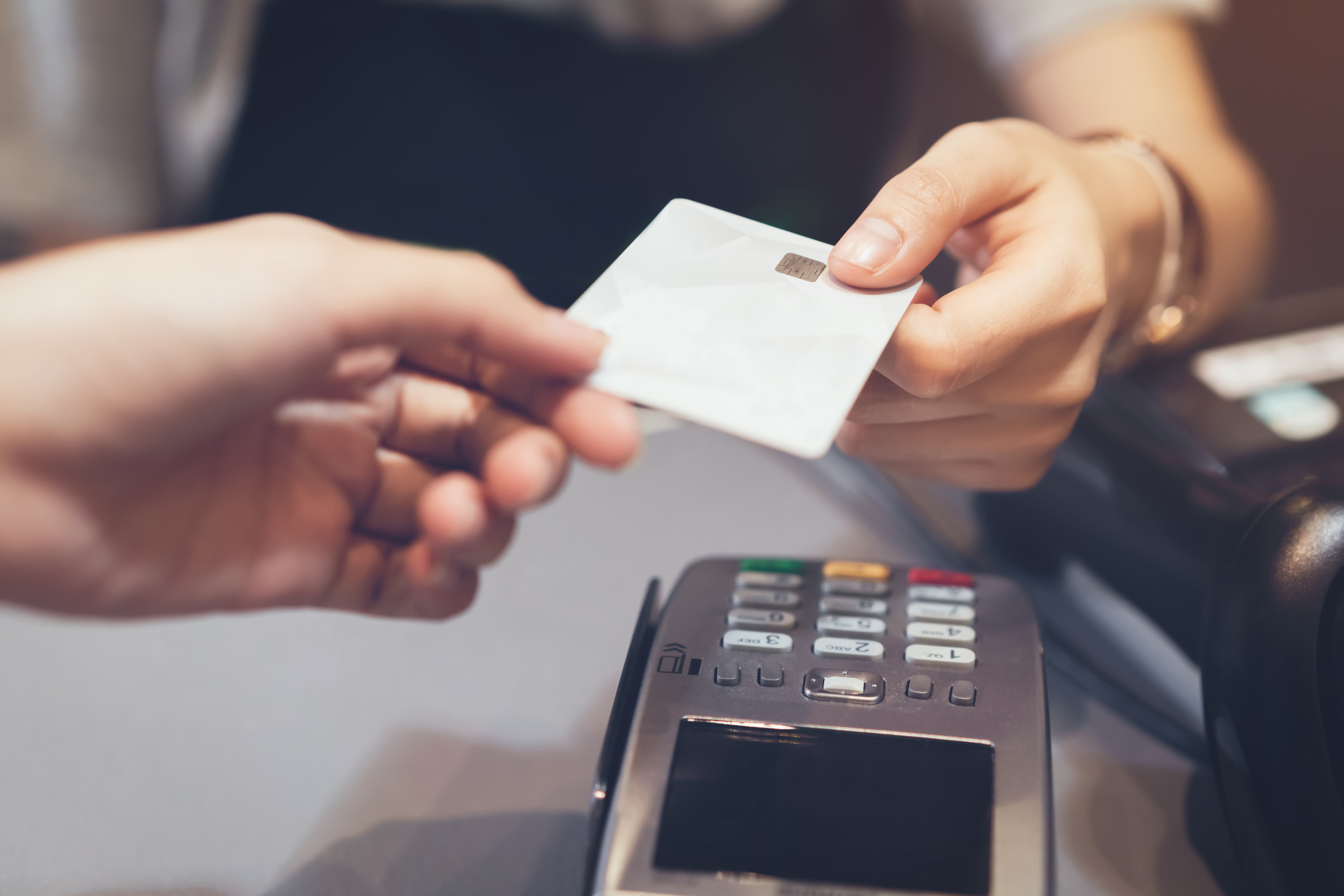 Person paying with a debit card