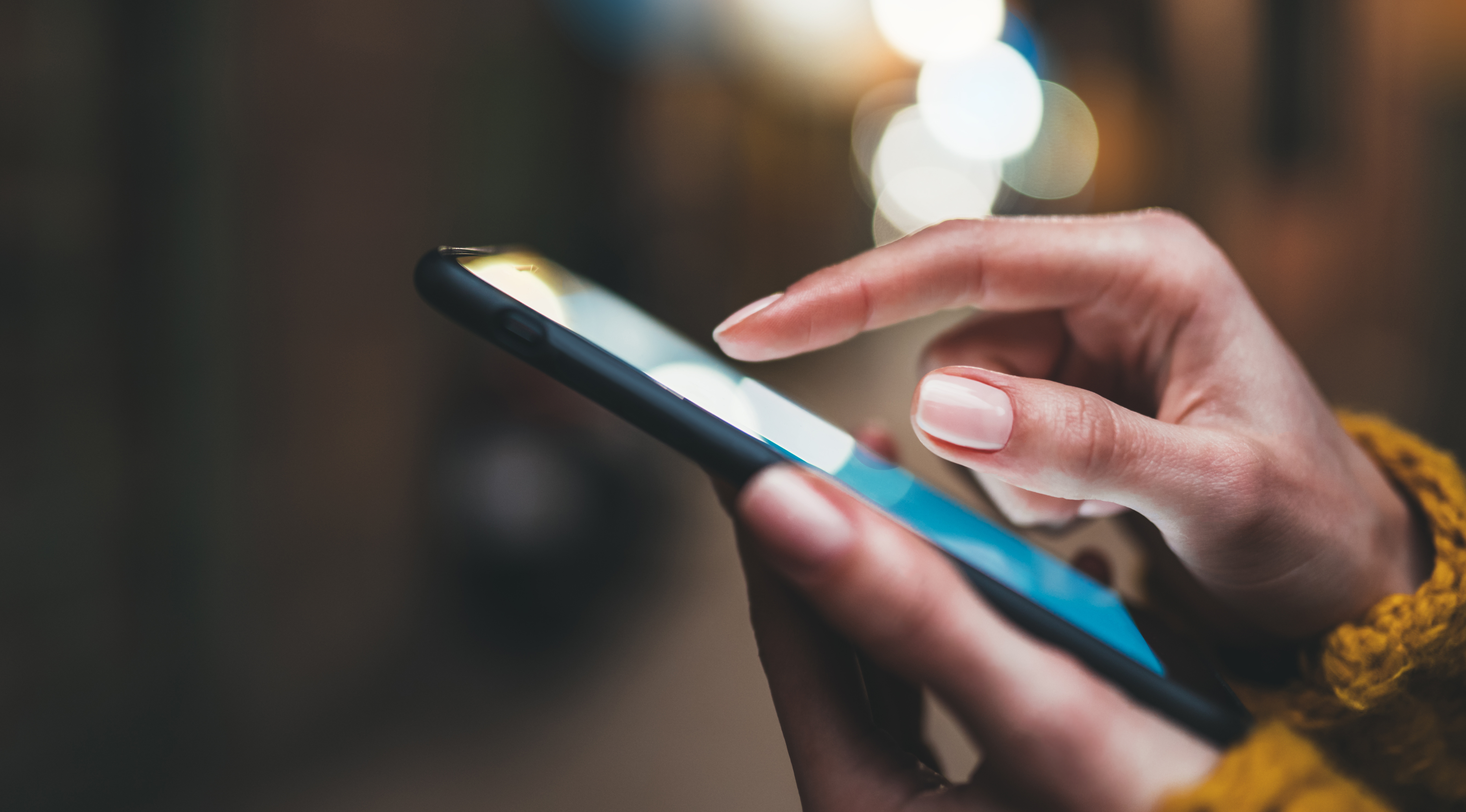 Person tapping on a mobile phone
