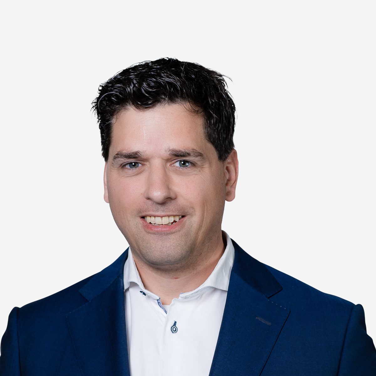 Portrait of mature businessman. Male executive is wearing T-shirt. Professional is smiling against gray background. Confident businessman with arms crossed. Mature mixed race man smiling