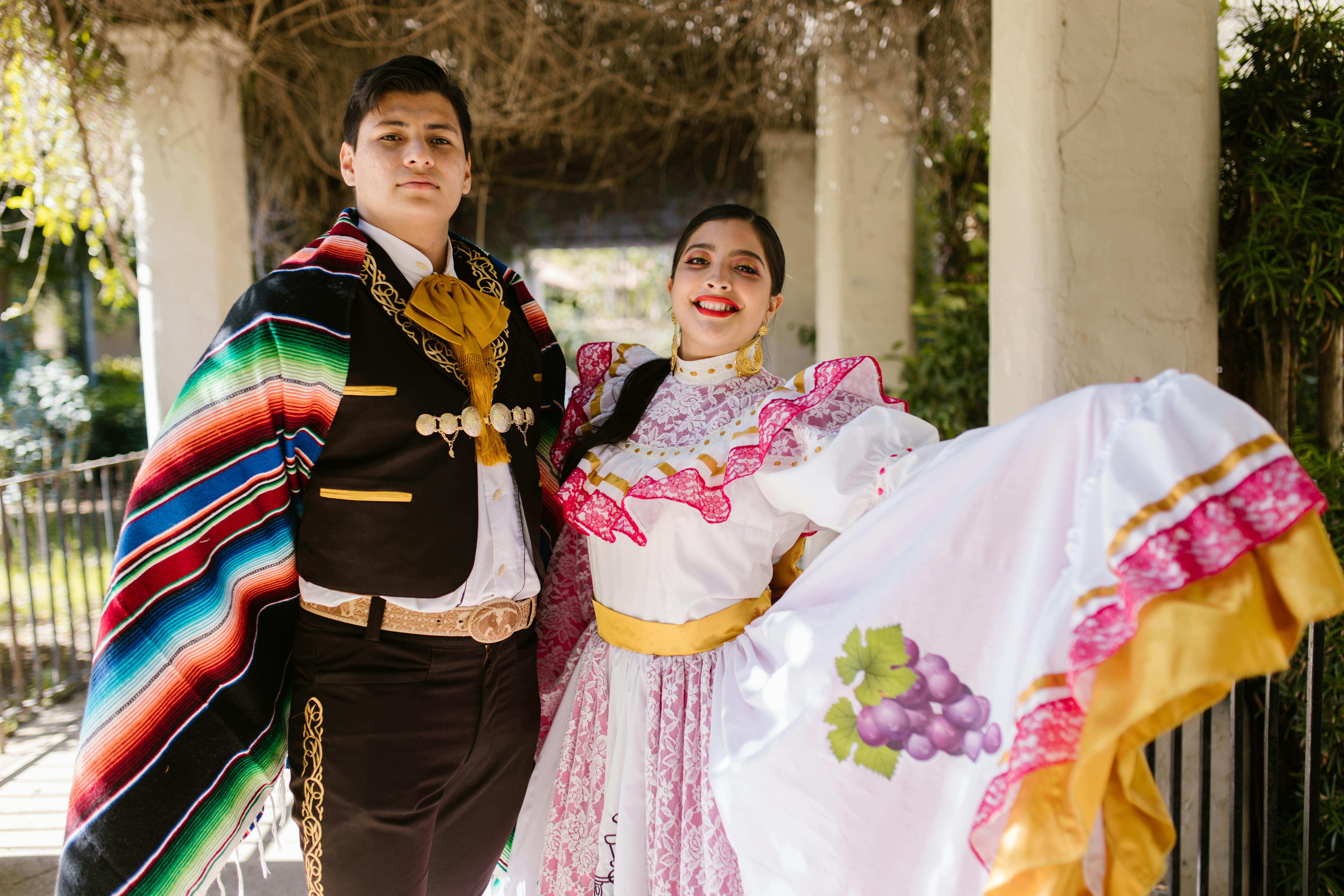 Man and woman dressed in festive Mexican outfits