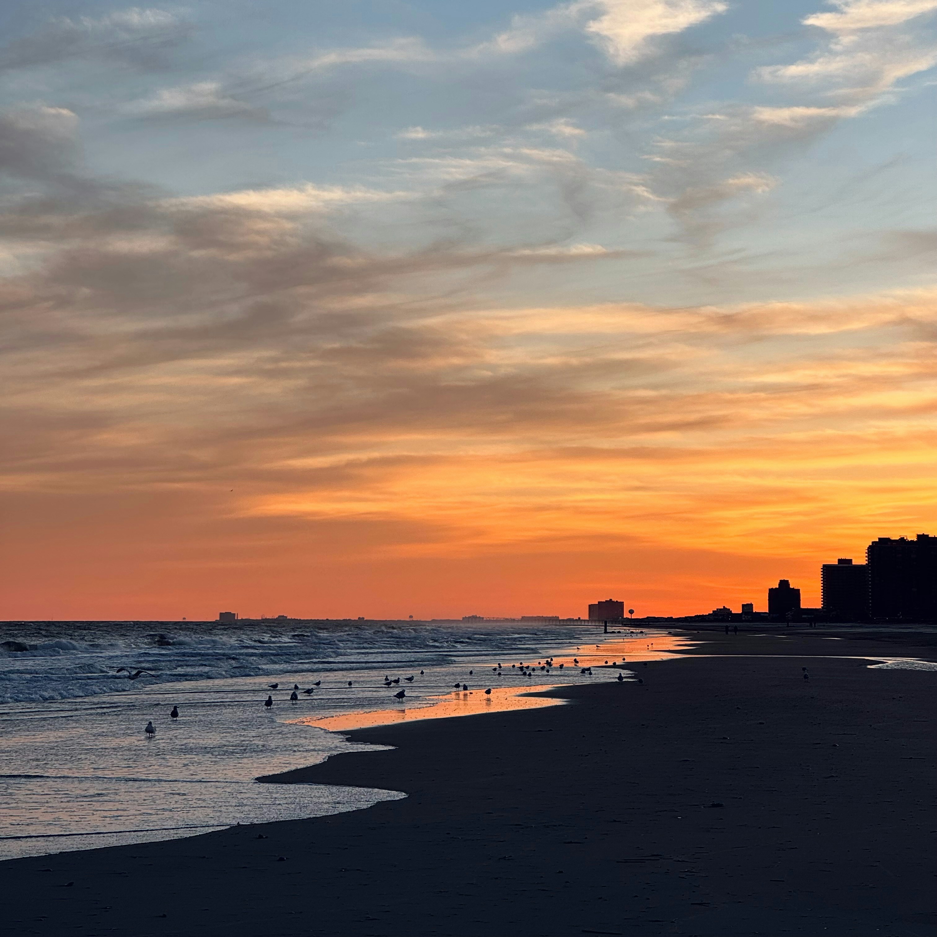 Bright orange sunset over the beach in Atlantic City