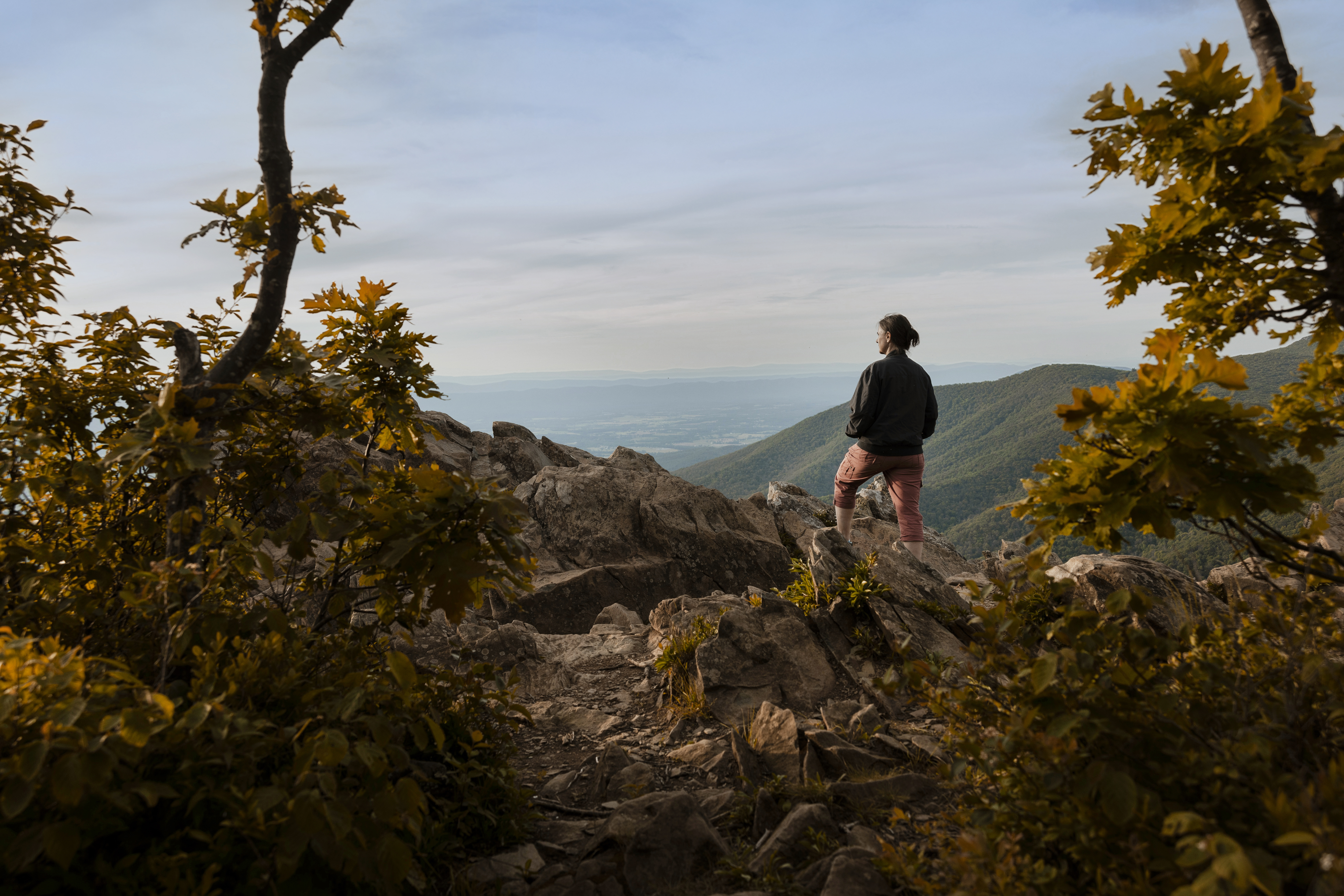Woman looking out over the valley at a lookout point in Shenandoah National Park