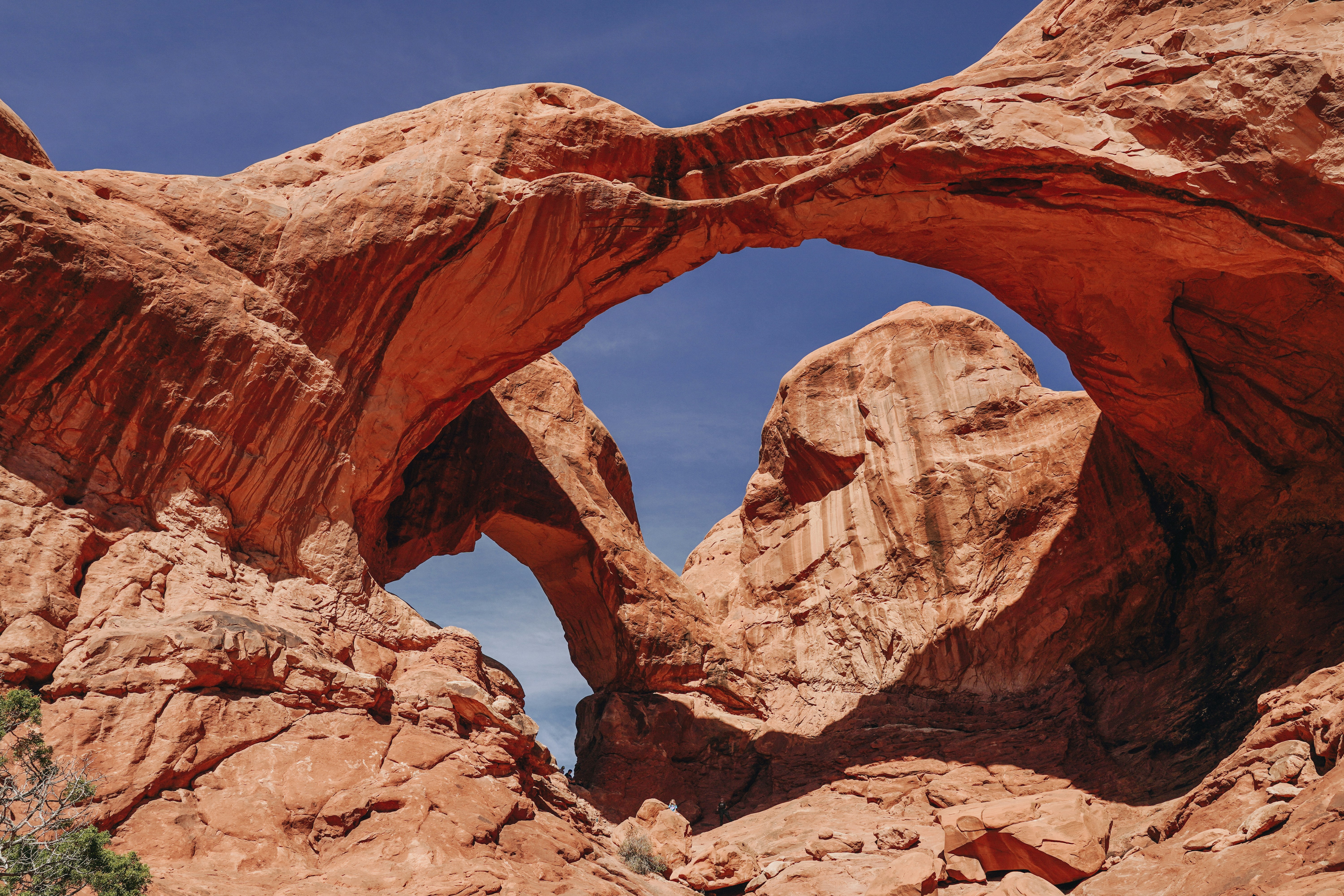 Looking up at arch-shaped rock formations