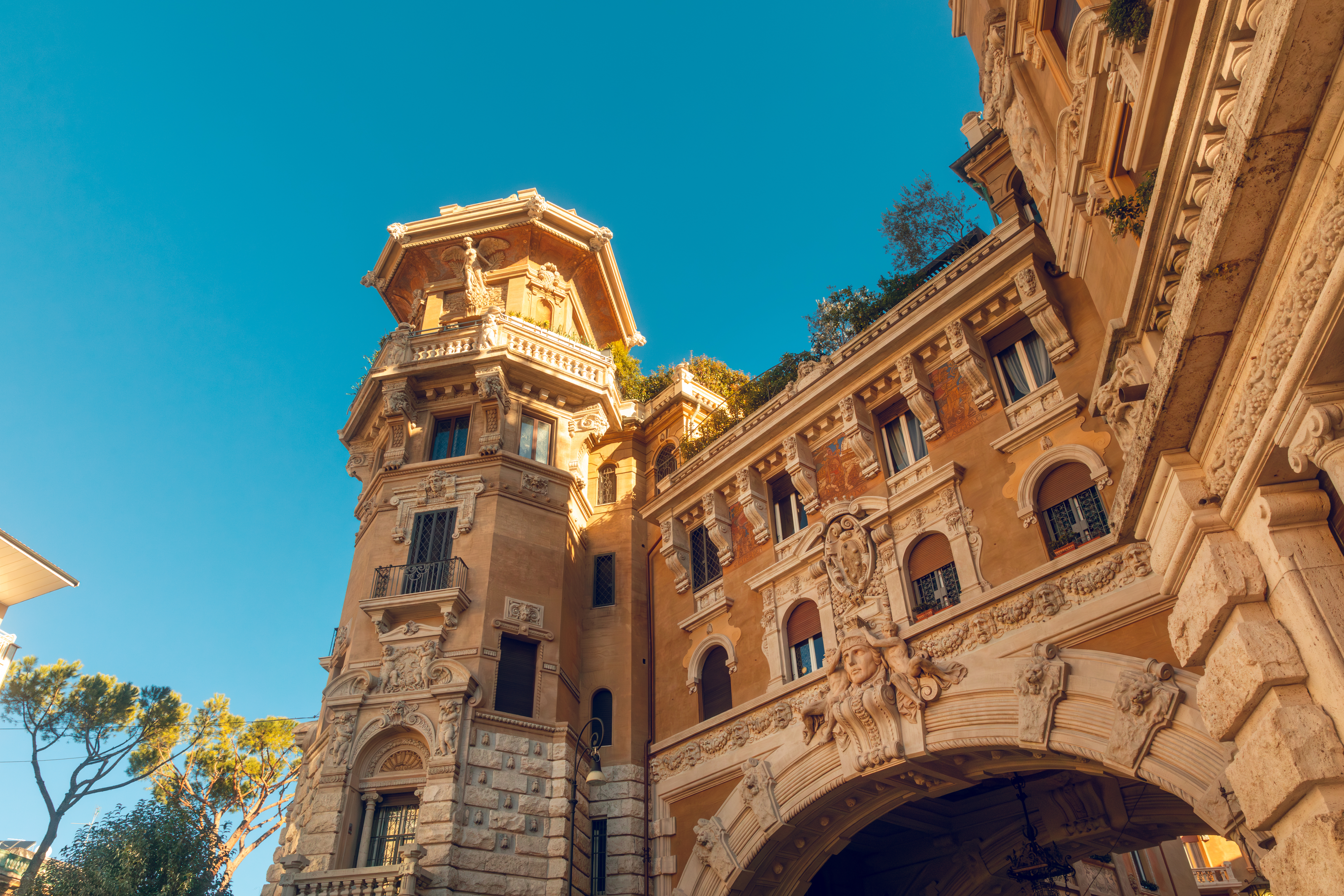 Quartiere Coppedè - Impressive Italian building with an arched entrance on the ground level