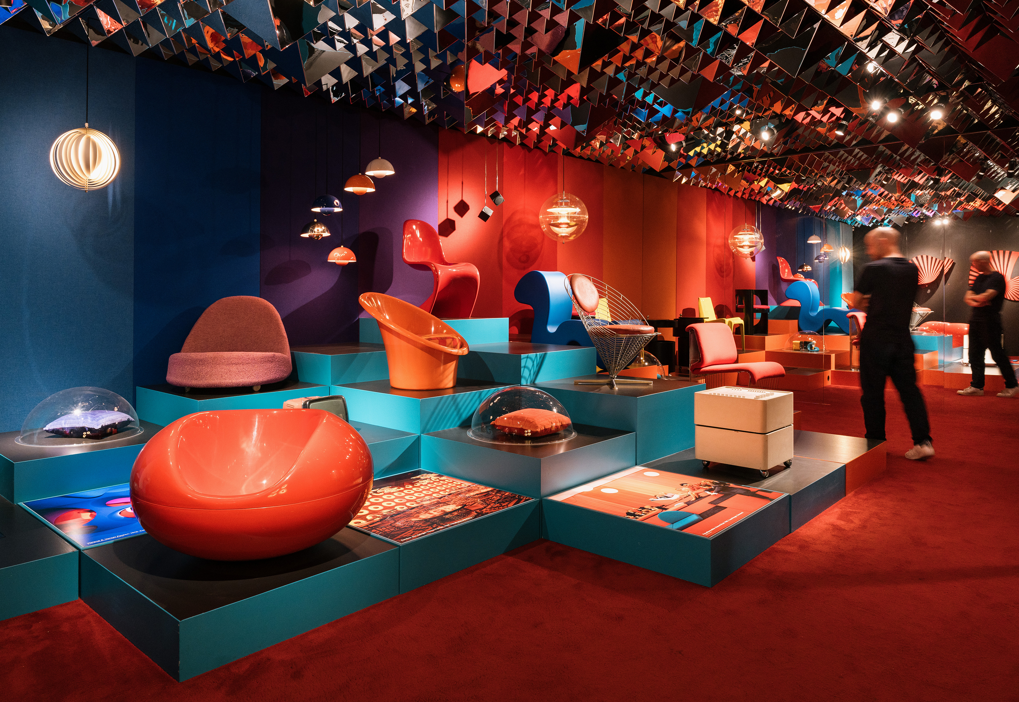 Designmuseum Danmark - Colorful Danish modern chairs on museum pedestals in a funky room