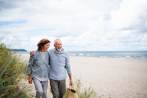 Image of a couple walking on the beach