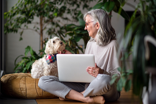 Image a woman and her dog 