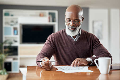 Image of a man looking at papers