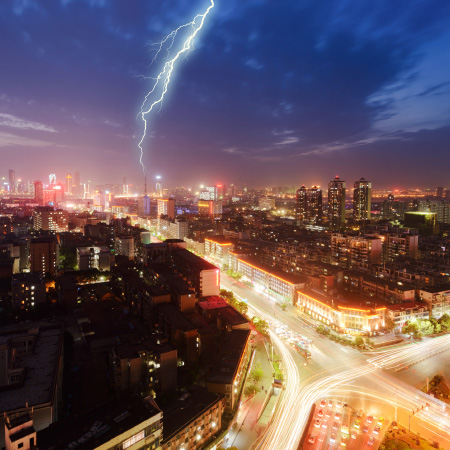 Image of a lightning storm over a cityscape