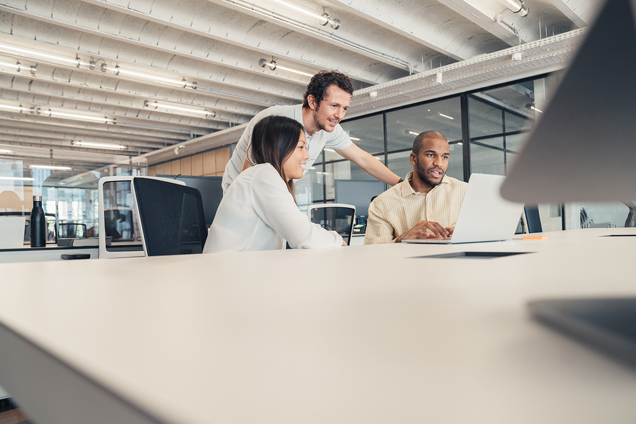 Man and woman looking at computer screen.