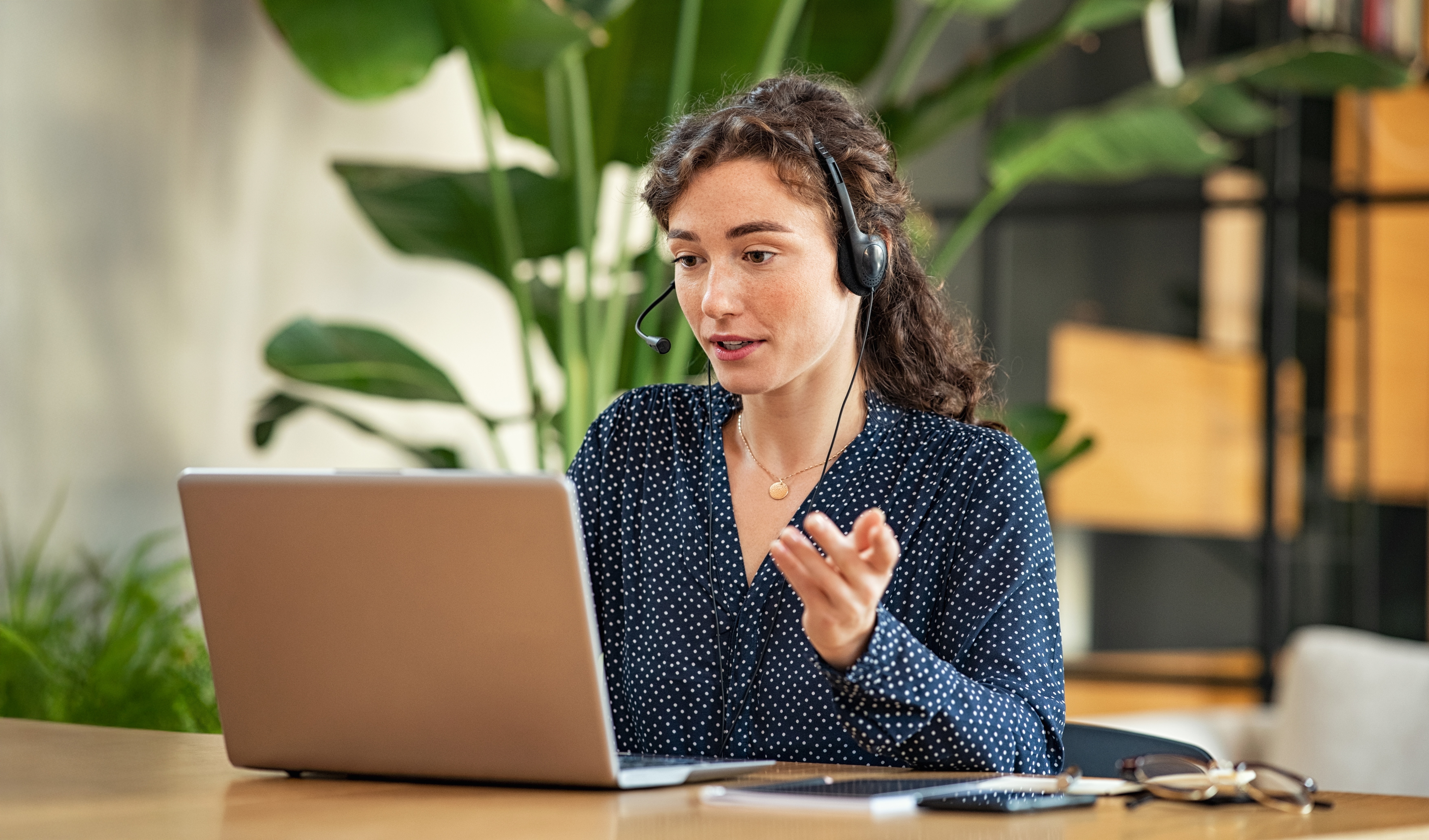 Man presenting to a table or colleagues 