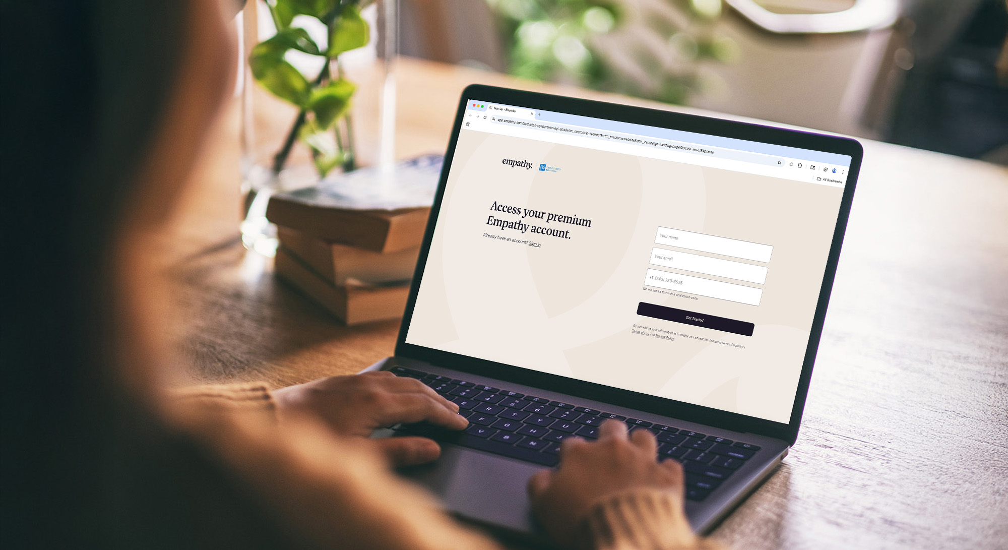 Man presenting to a table or colleagues 