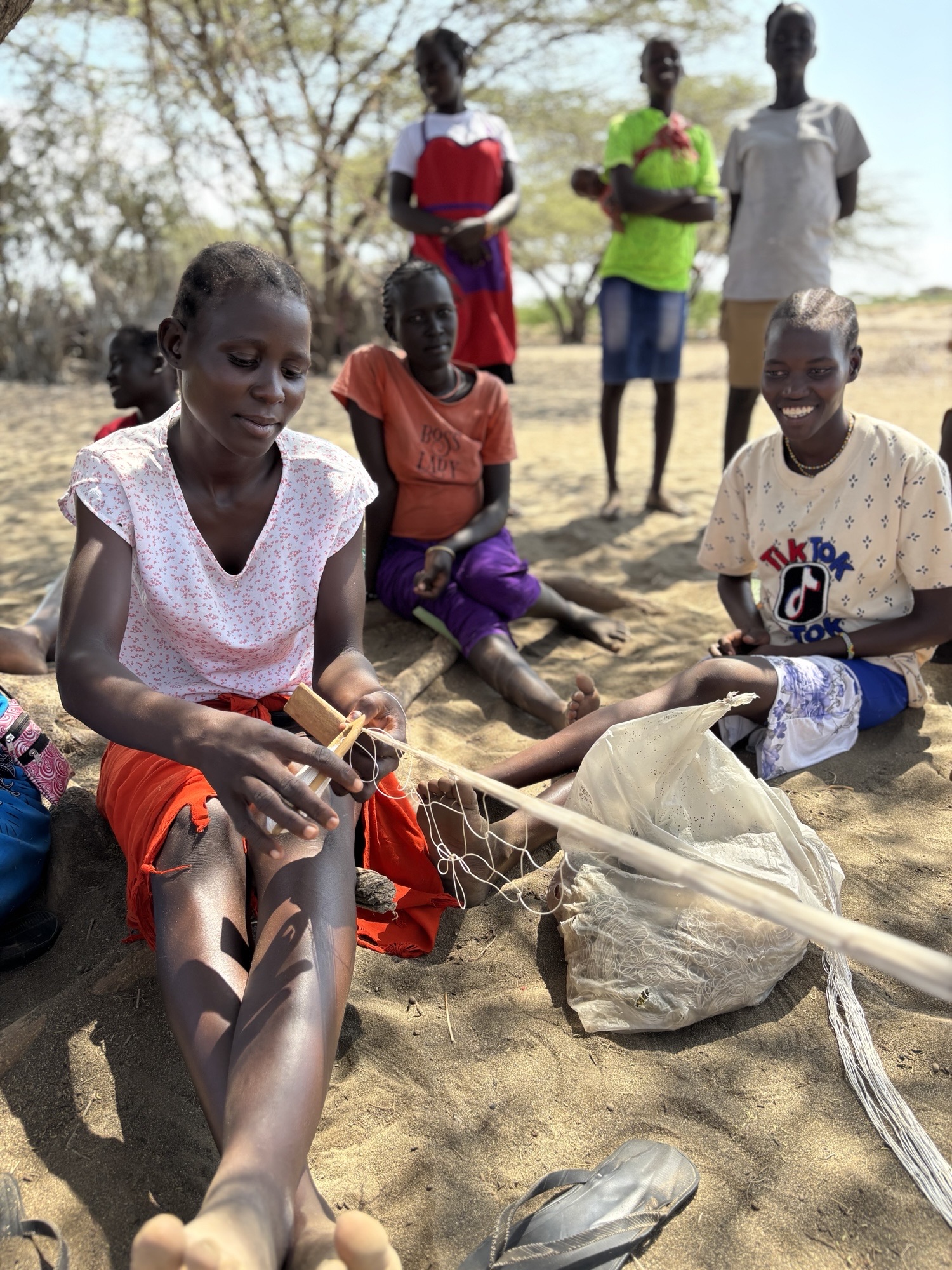 Portrait of Enthusiastic Hispanic Young Woman Working on Computer in a Modern Bright Office. Confident Human Resources Agent Smiling Happily While Collaborating Online with Colleagues.