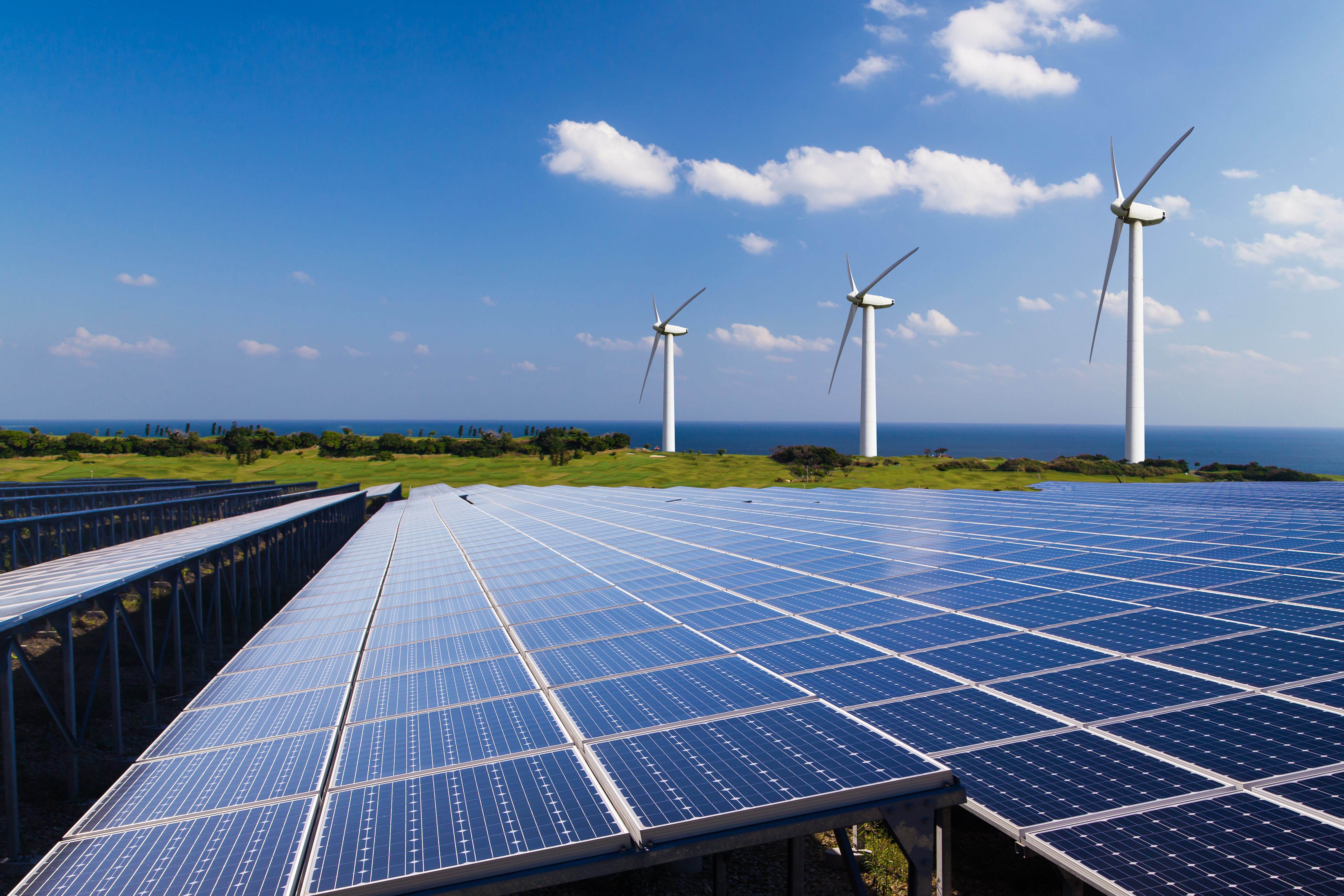 Header image of wind turbines and solar panels