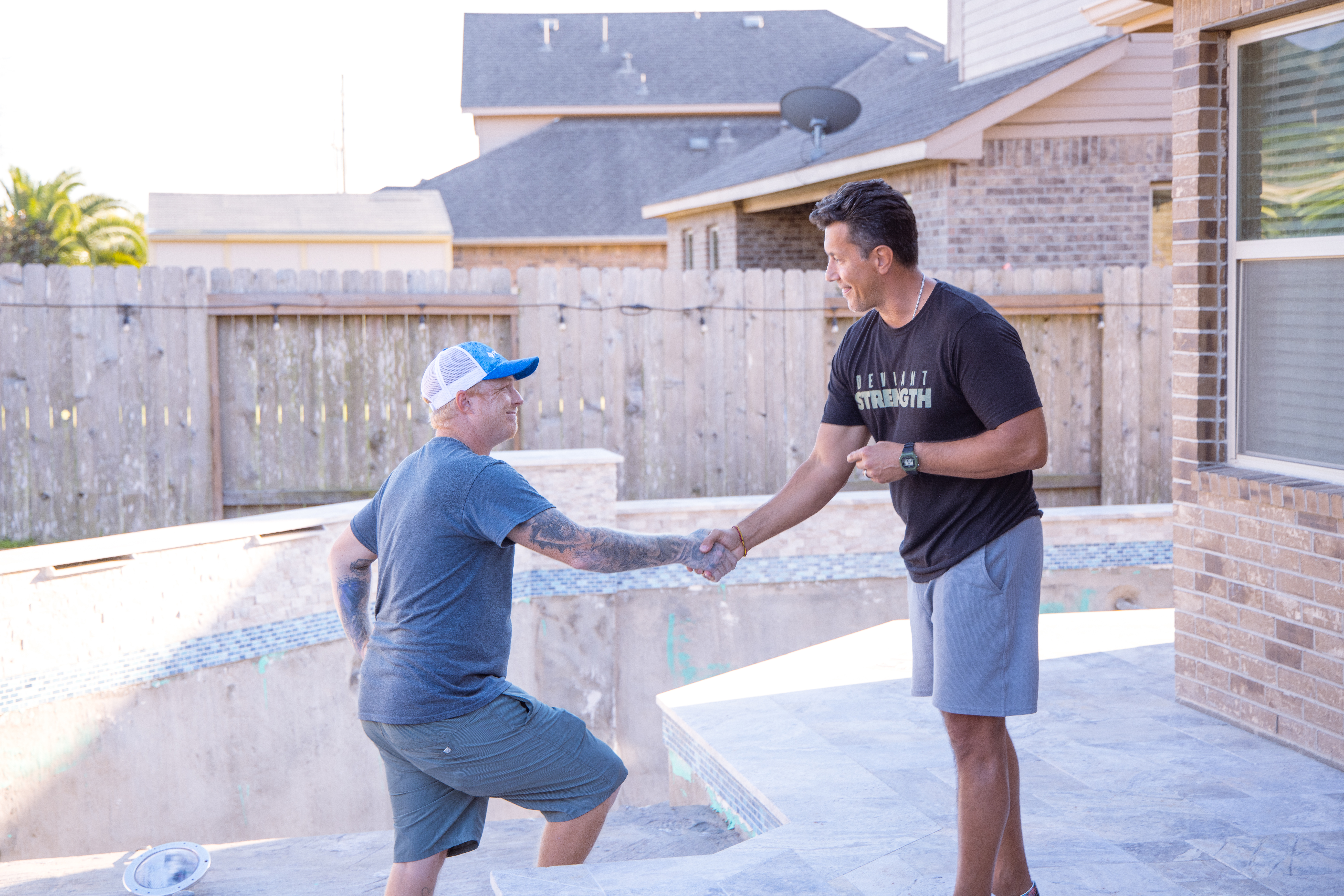 E - Expert Advice. Image: Two men, a pool expert standing on an empty pool stairway and pool owner standing on the patio, are shaking hands and smiling. Pentair recommends all filter maintenance be performed by a pool professional.