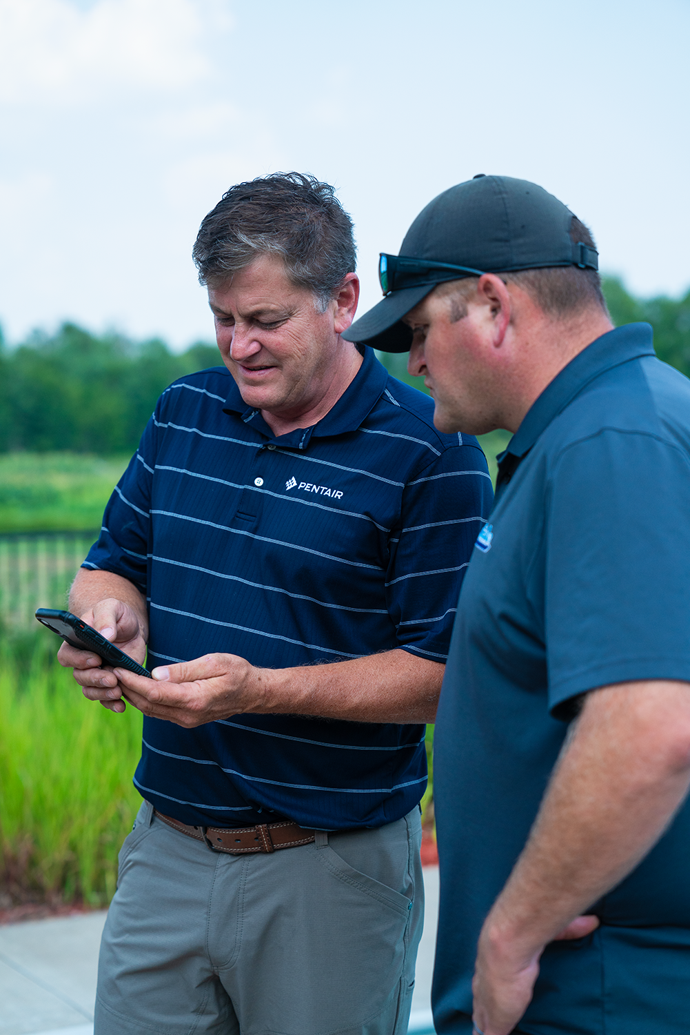 First image: Two men in polos looking at a phone. Title: Nominate. Text: Sept. 2 – Oct. 19, 2025. 