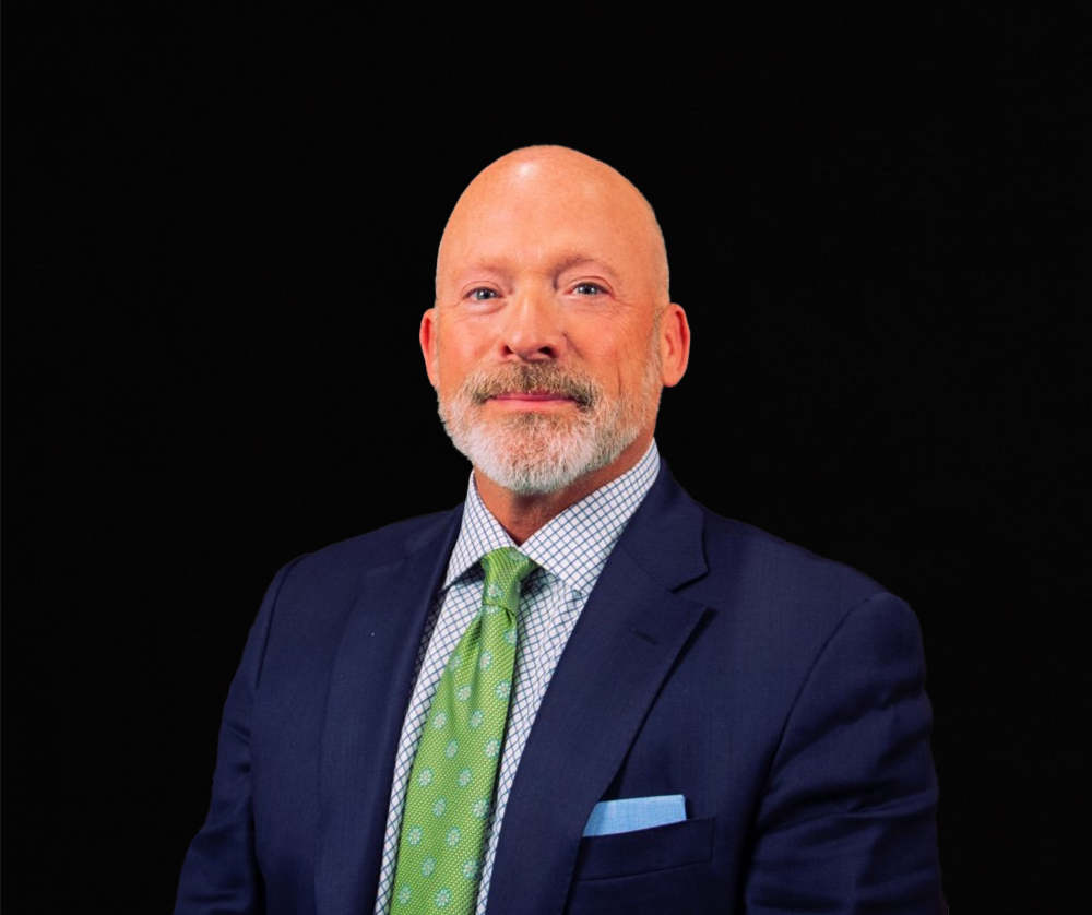 Headshot portrait of smiling young African American businessman in suit pose in own modern office. Profile picture of happy successful male boss or CEO in formalwear show confidence and leadership.