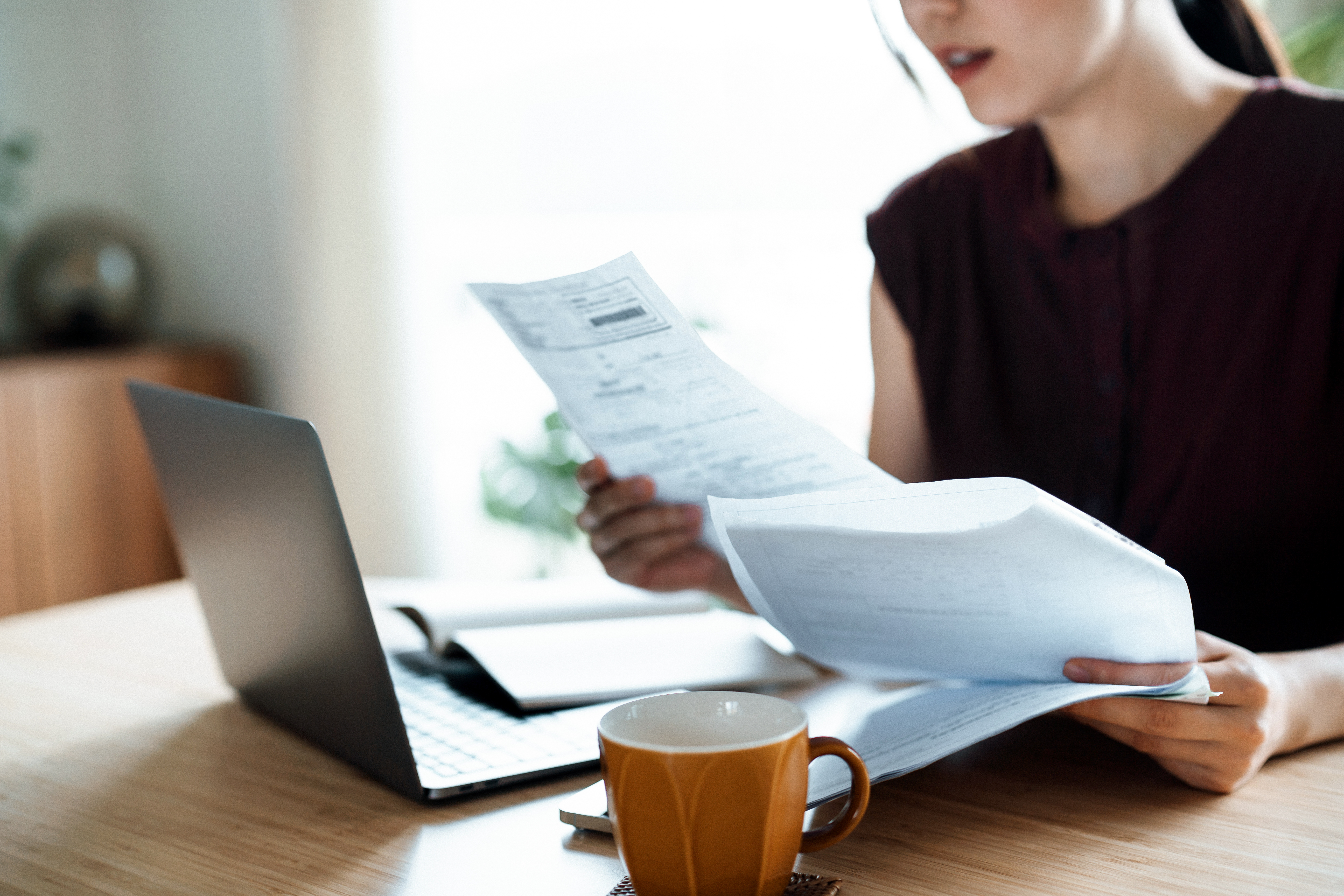 women sitting down looking at documents