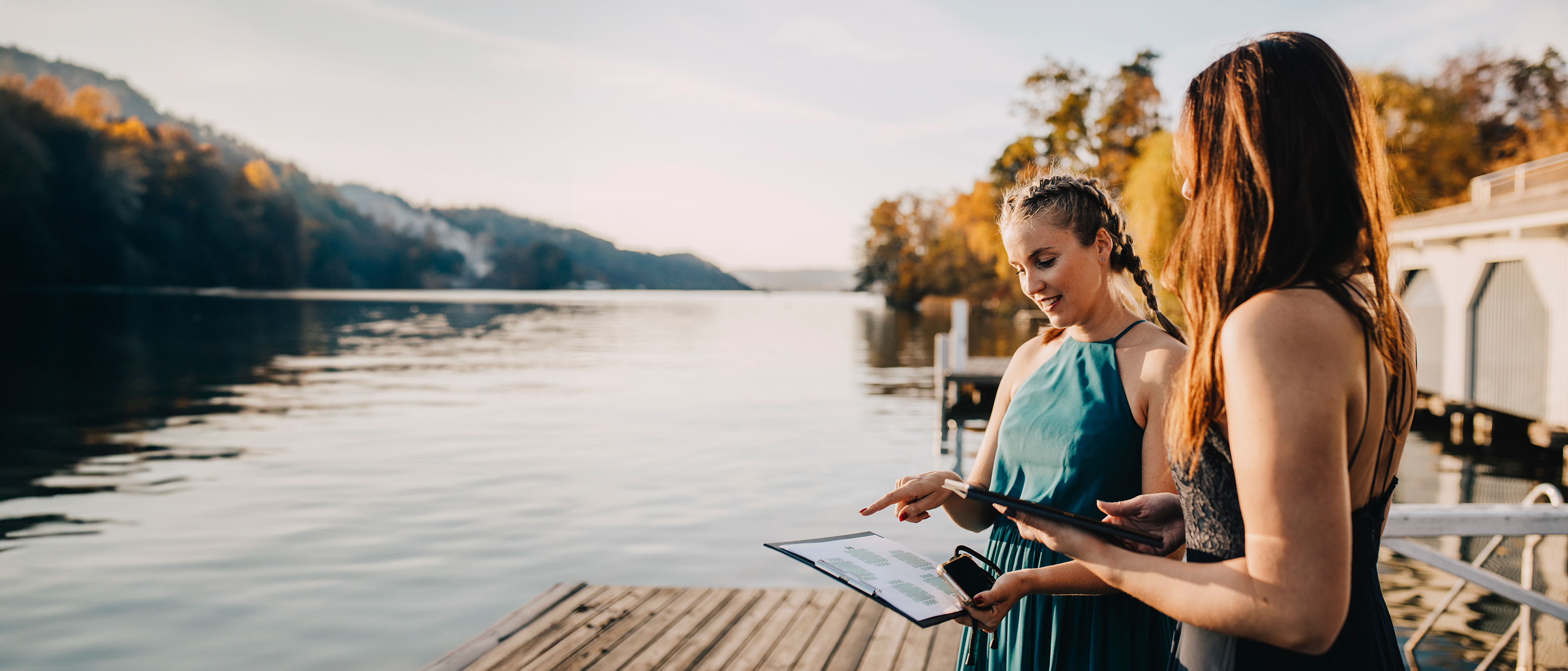 Event planner with woman going over plans