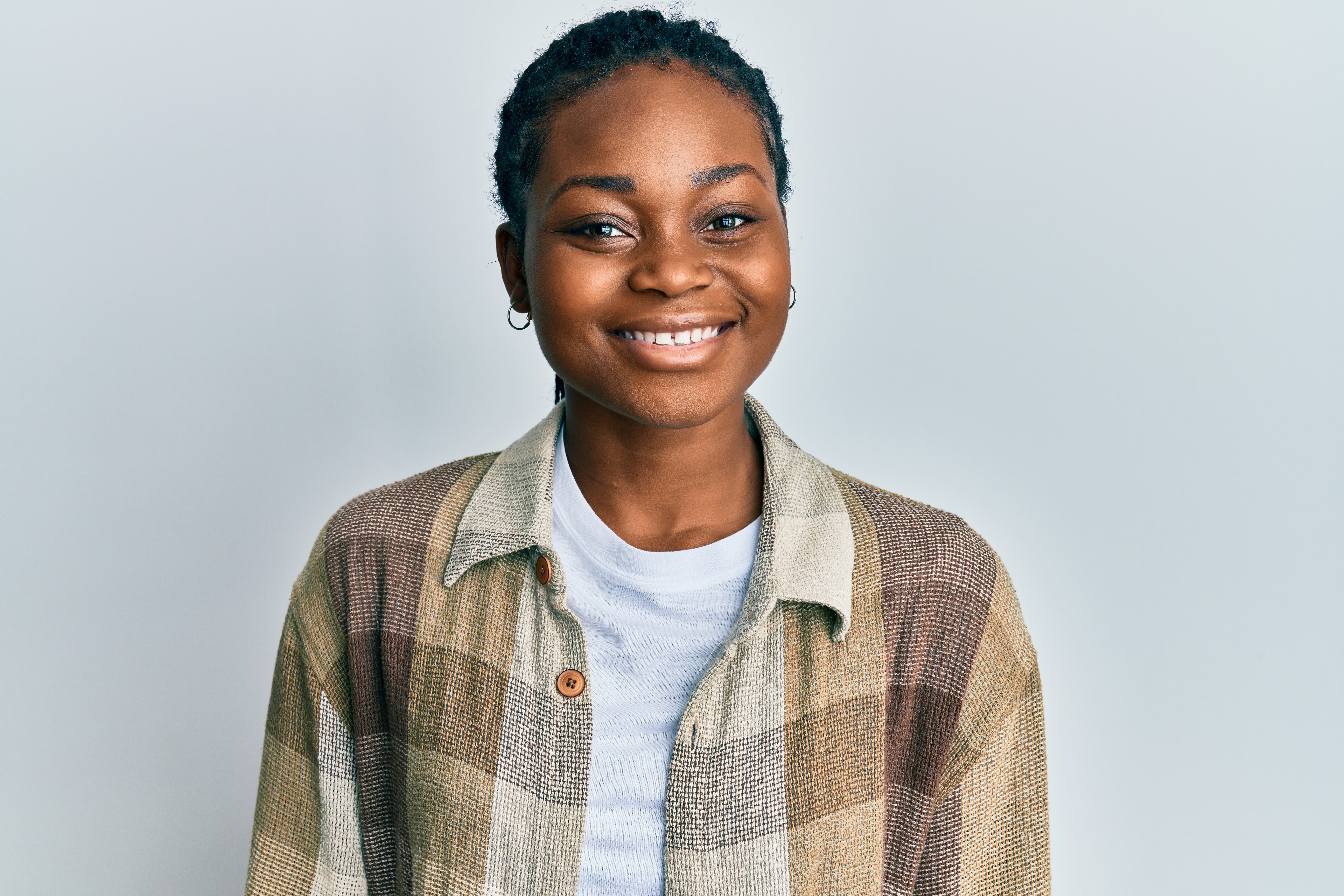 young african american woman with her hair up smiling 