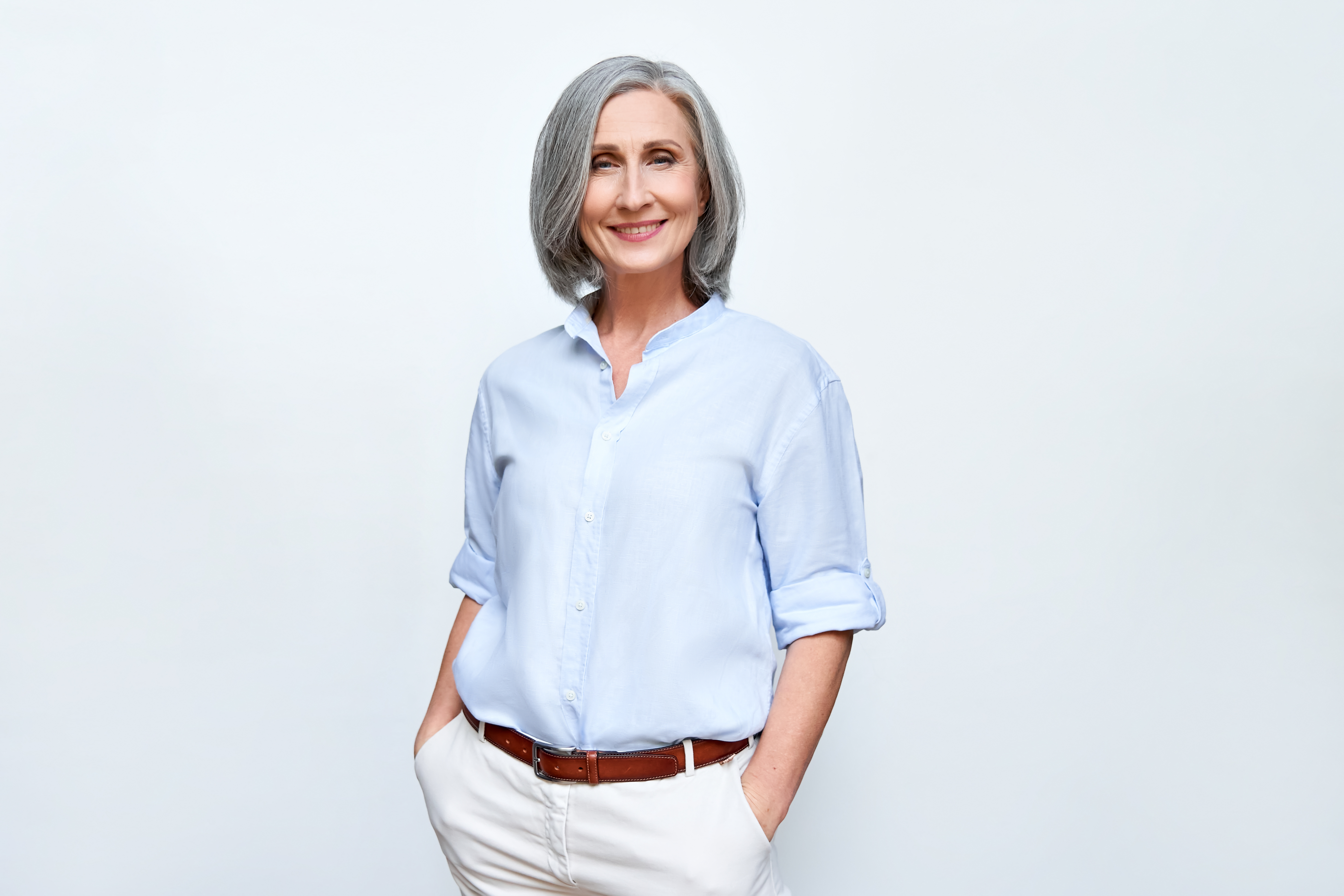 older-middle aged woman with short gray hair smiling 