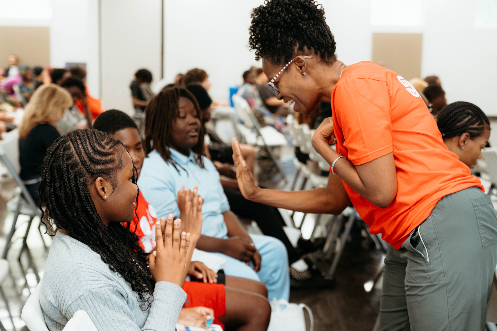 teacher high fiving a student 