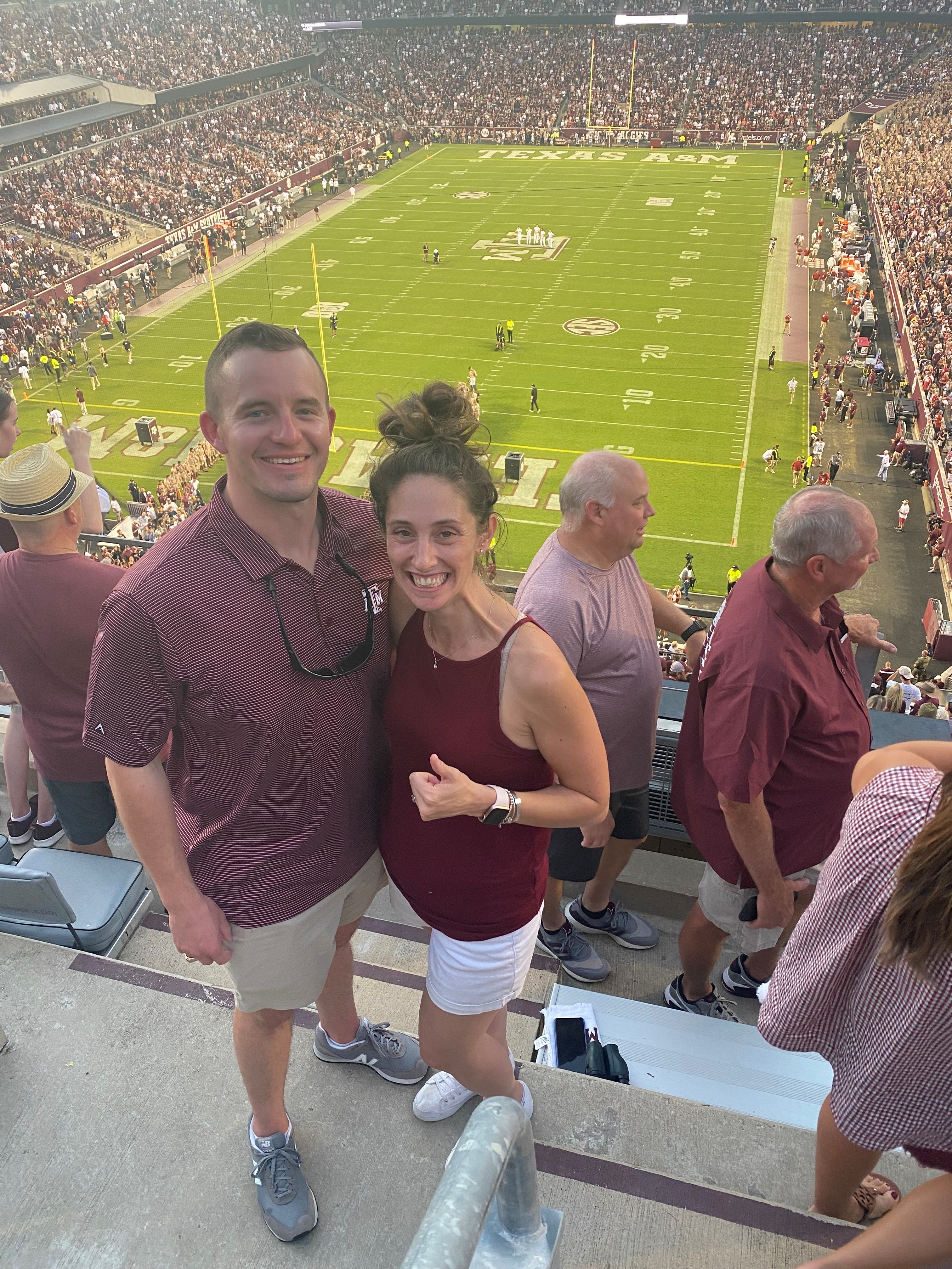 Man and woman together at football game