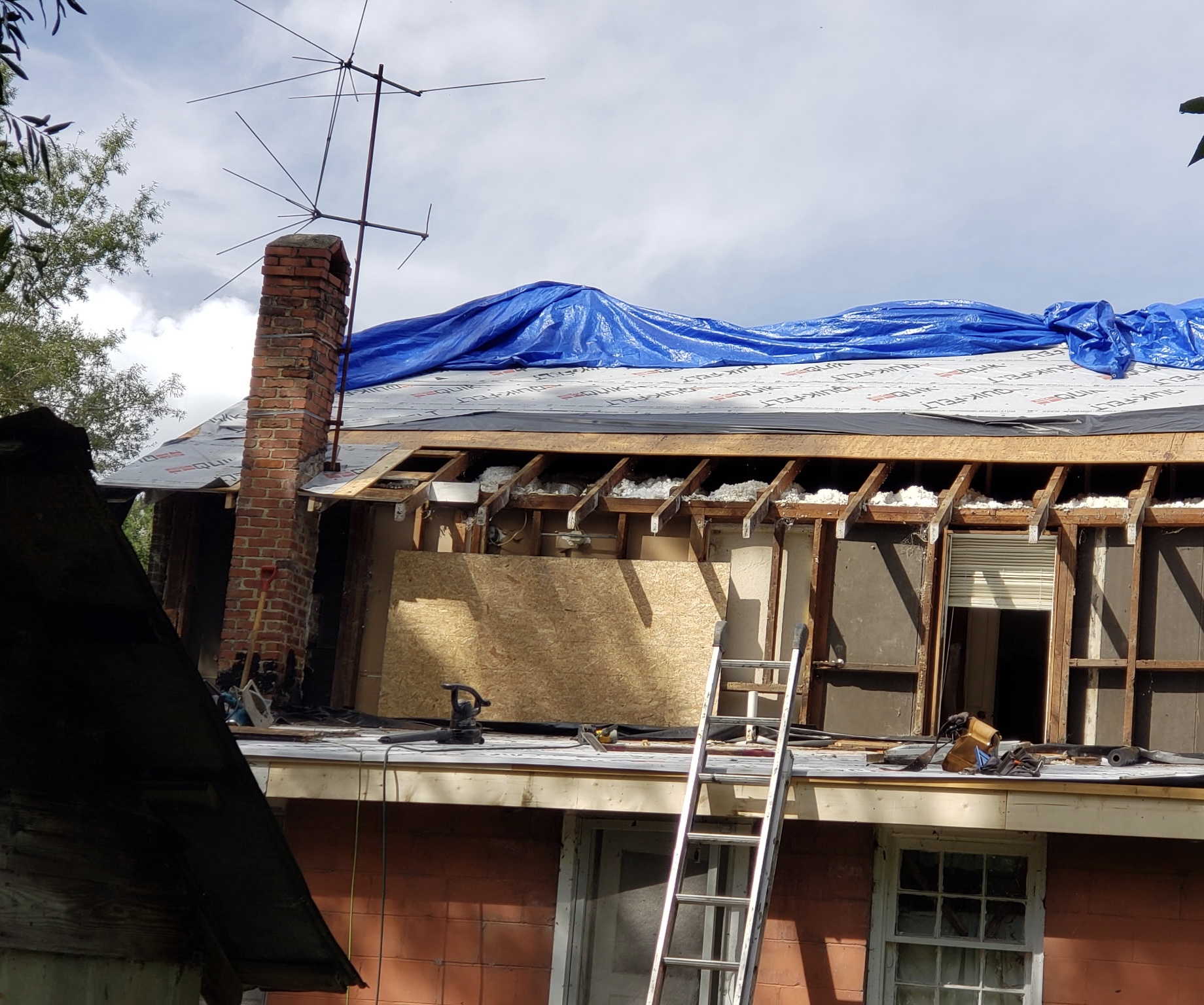 Roof of Alex's home being worked on